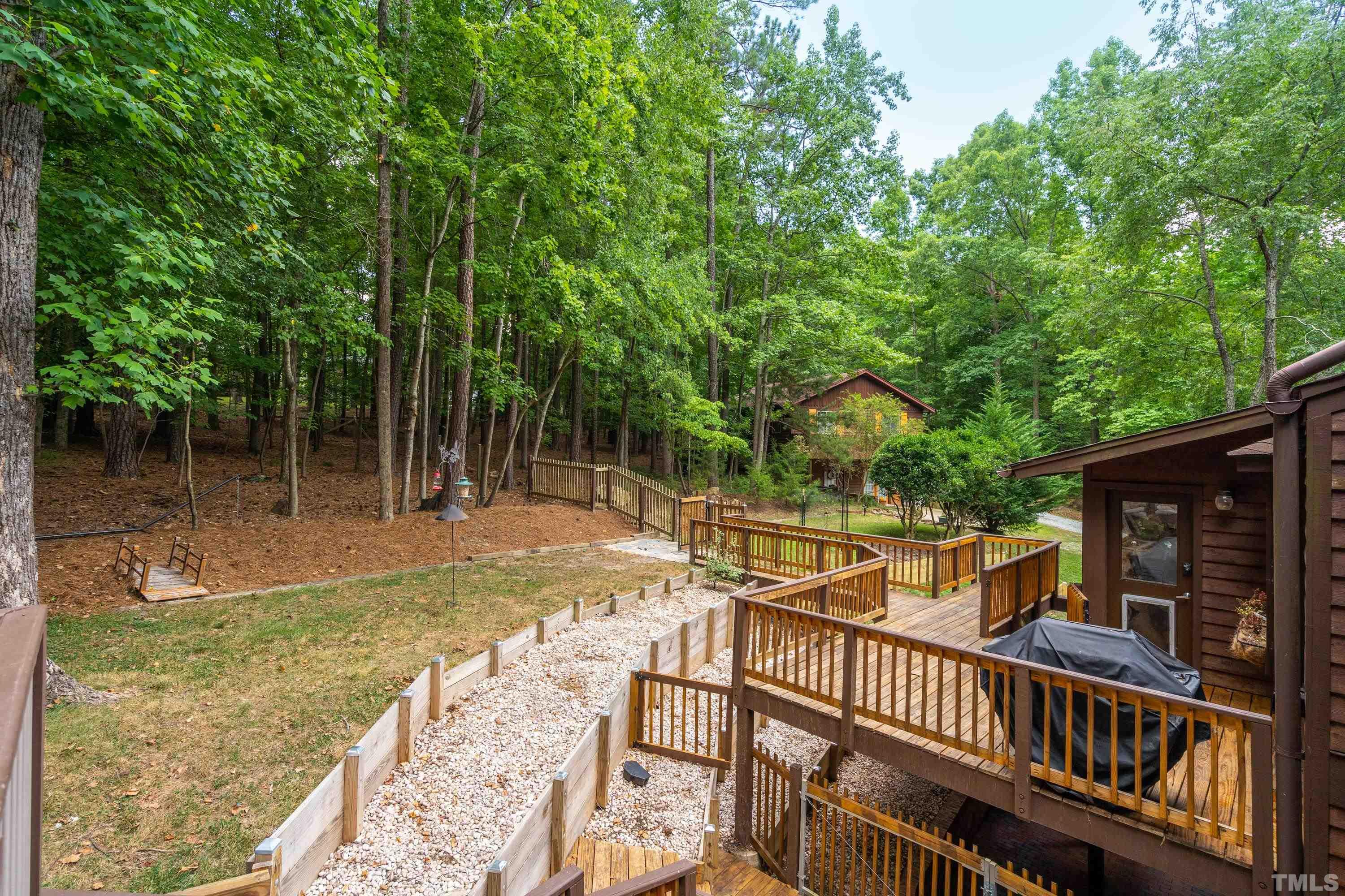 2600 Ferrand Drive Durham, NC 27705 - Photo 44 of 67 a view of backyard with deck and outdoor seating