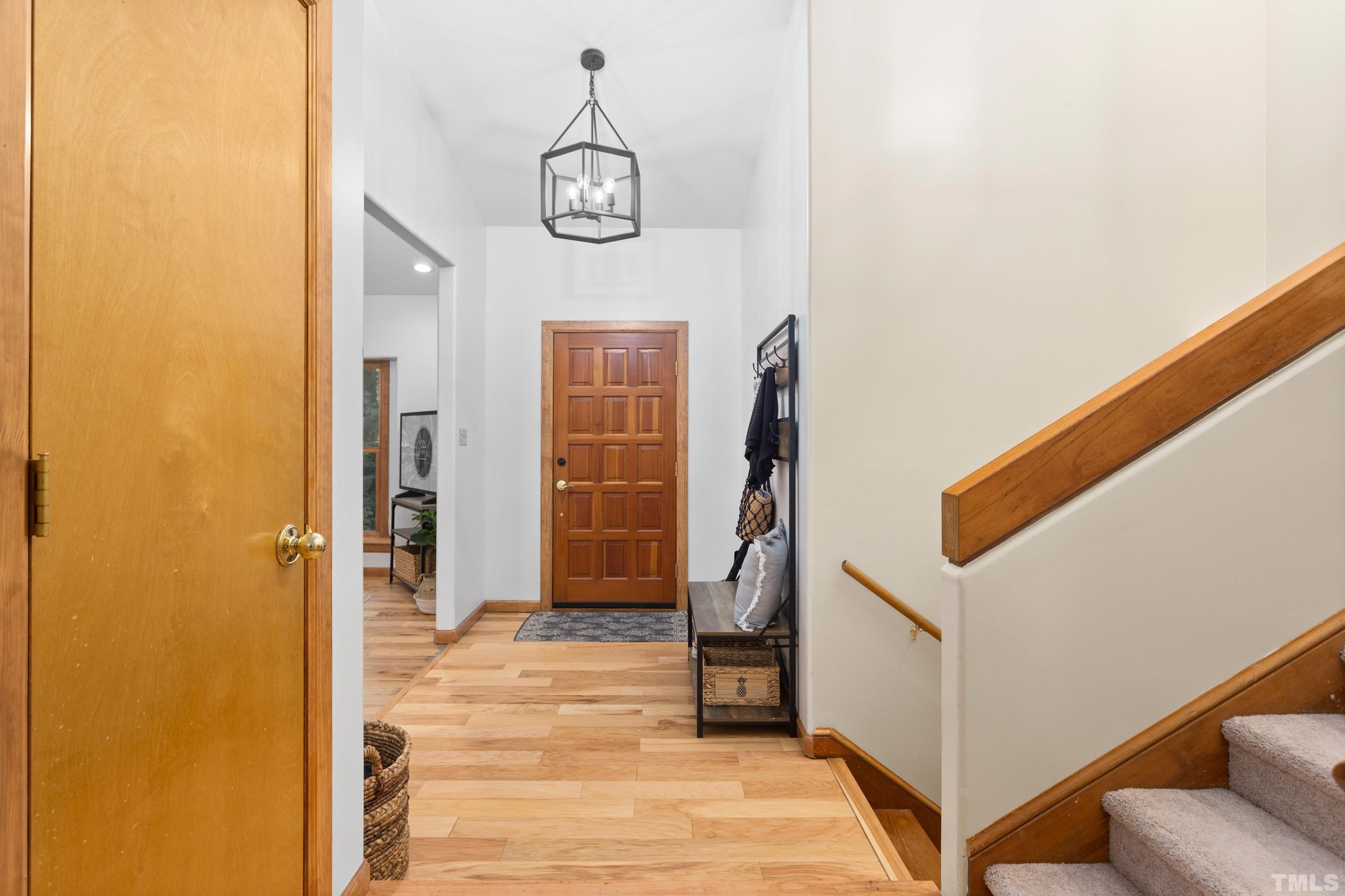 2600 Ferrand Drive Durham, NC 27705 - Photo 5 of 67 a view of a hallway with wooden floor and staircase