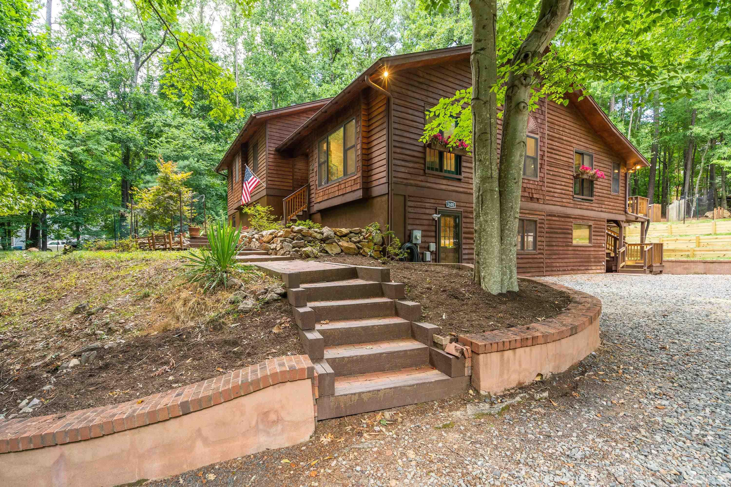 2600 Ferrand Drive Durham, NC 27705 - Photo 51 of 67 a front view of a house with garden
