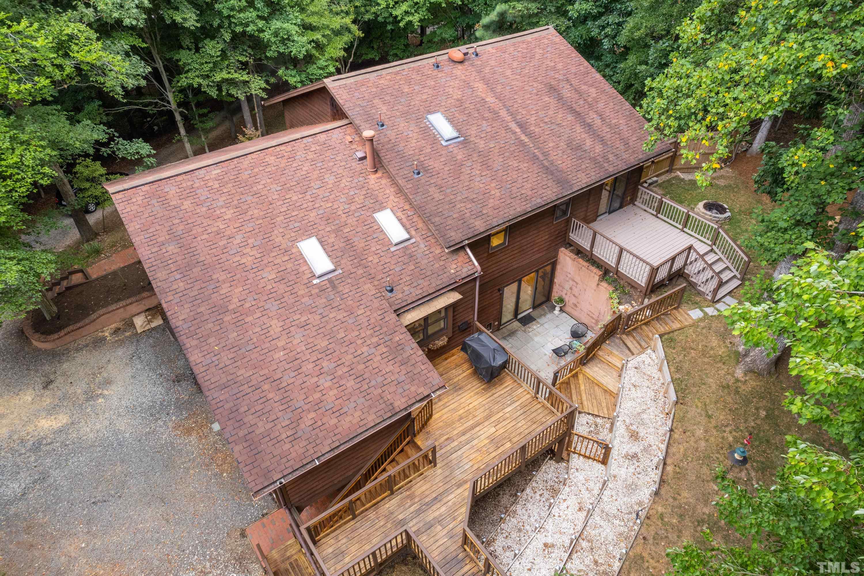 2600 Ferrand Drive Durham, NC 27705 - Photo 57 of 67 an aerial view of a house with a yard and trees