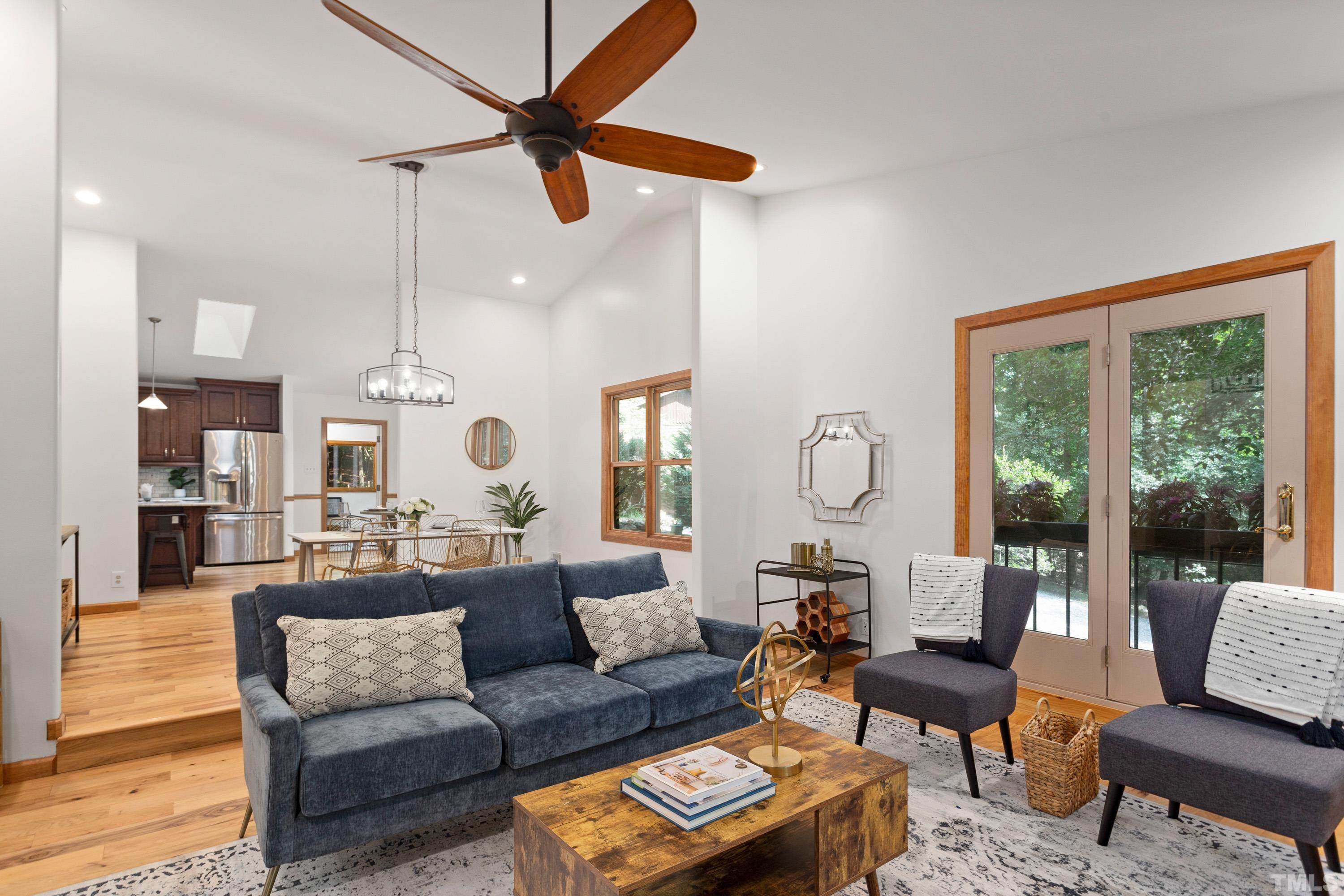 2600 Ferrand Drive Durham, NC 27705 - Photo 7 of 67 a living room with furniture ceiling fan and a large window