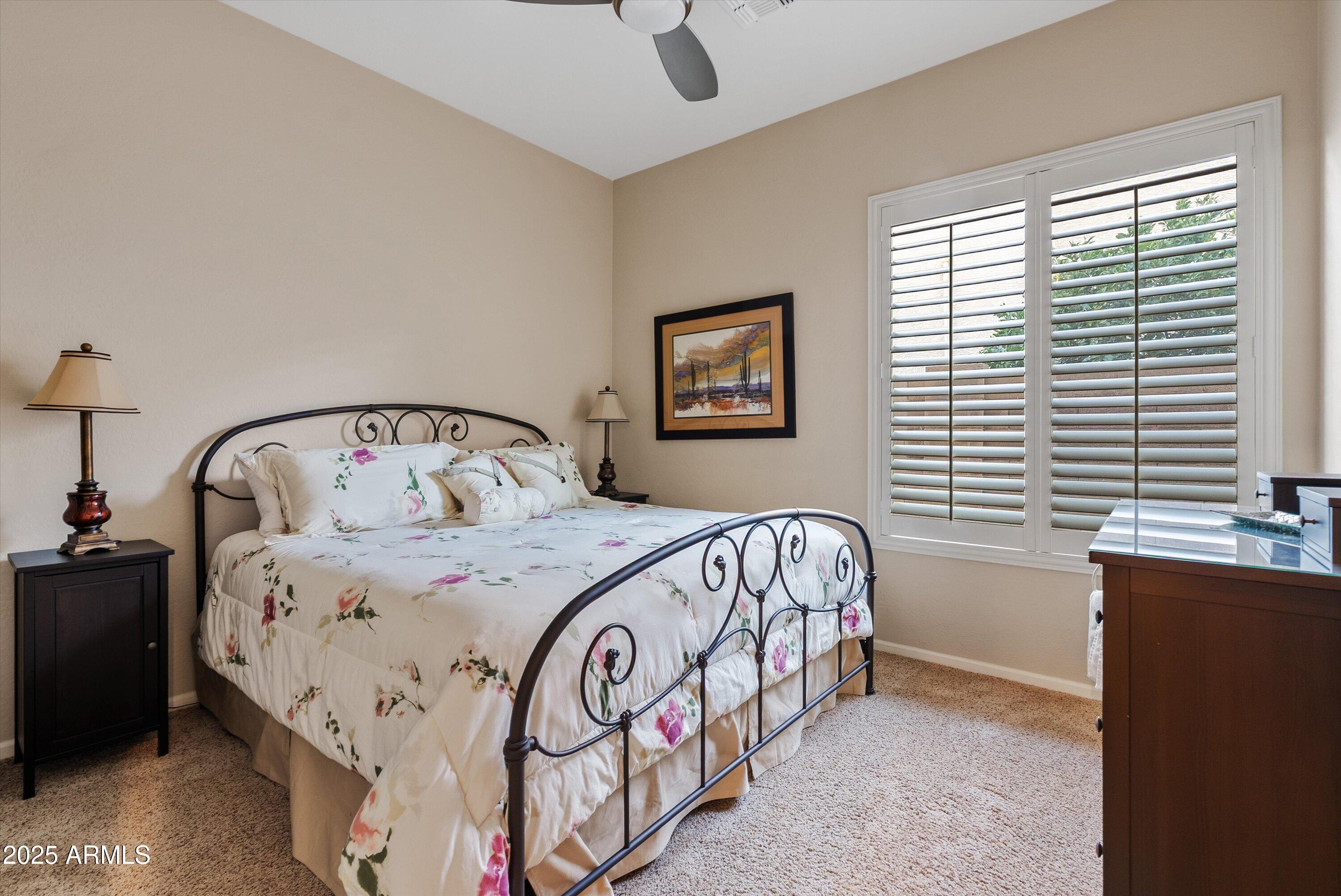 6805 Rachael Way Gilbert, AZ 85298 - Photo 24 of 50 a bedroom with a bed and a chandelier