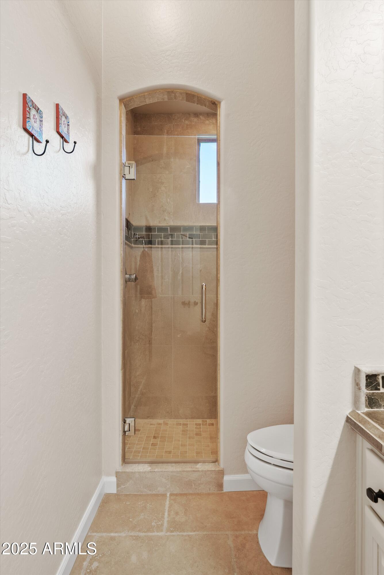6805 Rachael Way Gilbert, AZ 85298 - Photo 29 of 50 a bathroom with a toilet and a shower