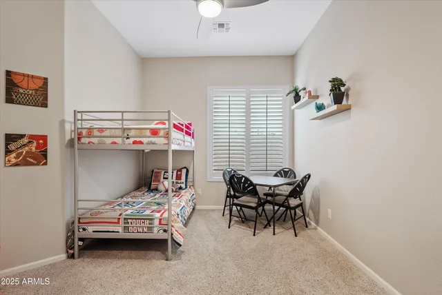 a bathroom with a granite countertop sink a mirror and a shower
