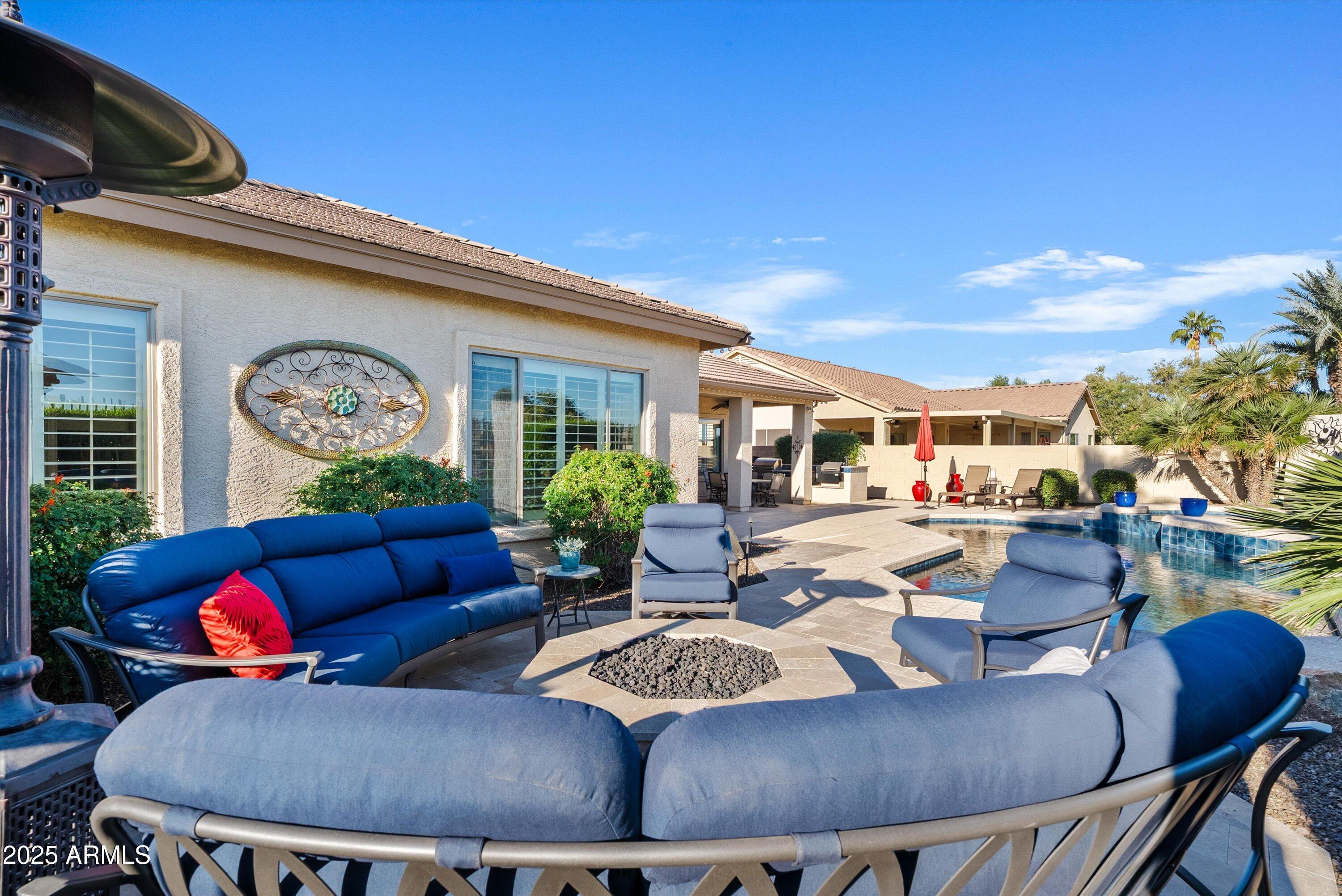 6805 Rachael Way Gilbert, AZ 85298 - Photo 39 of 50 a outdoor living space with furniture and a clock