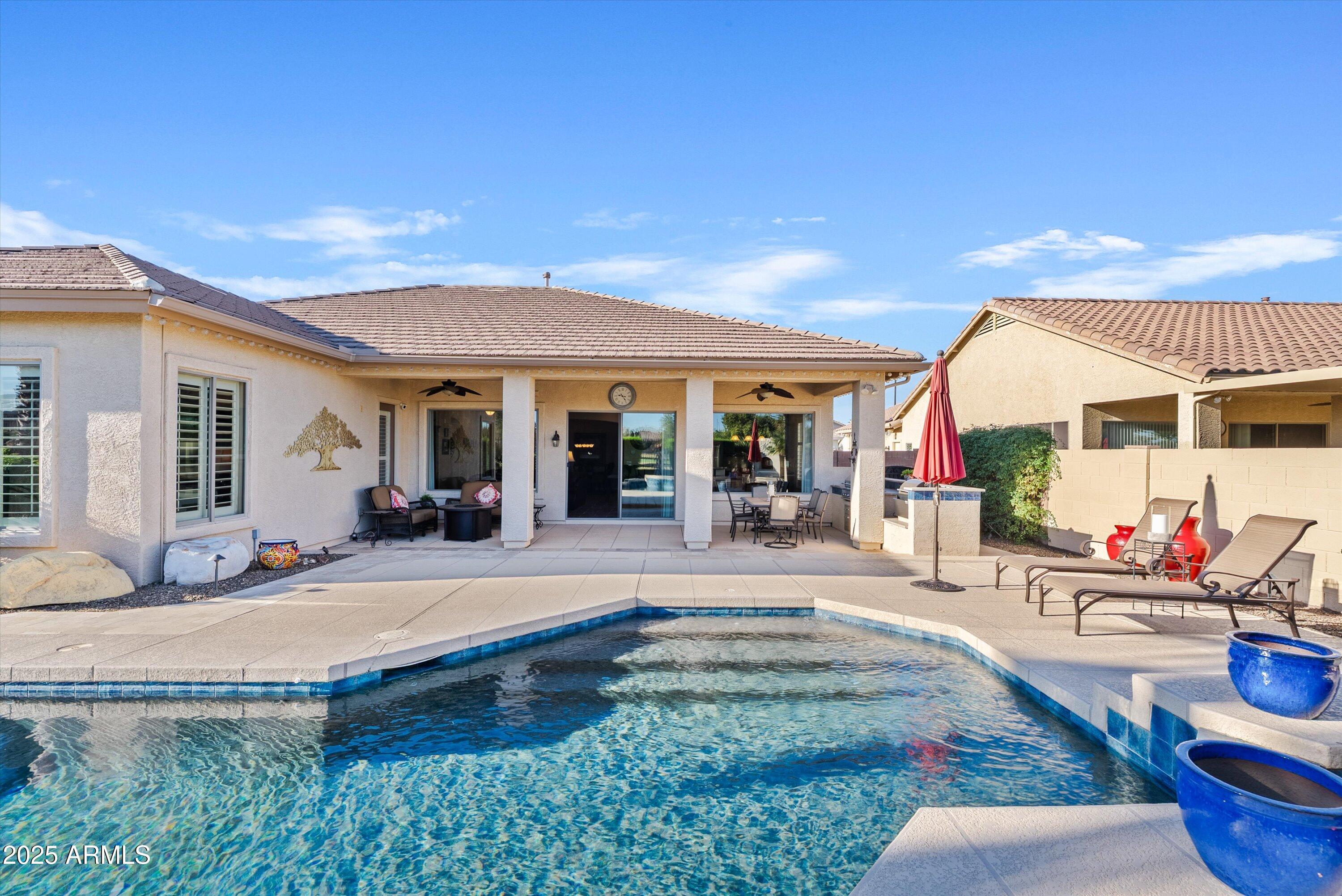 6805 Rachael Way Gilbert, AZ 85298 - Photo 40 of 50 a view of a house with backyard patio and swimming pool