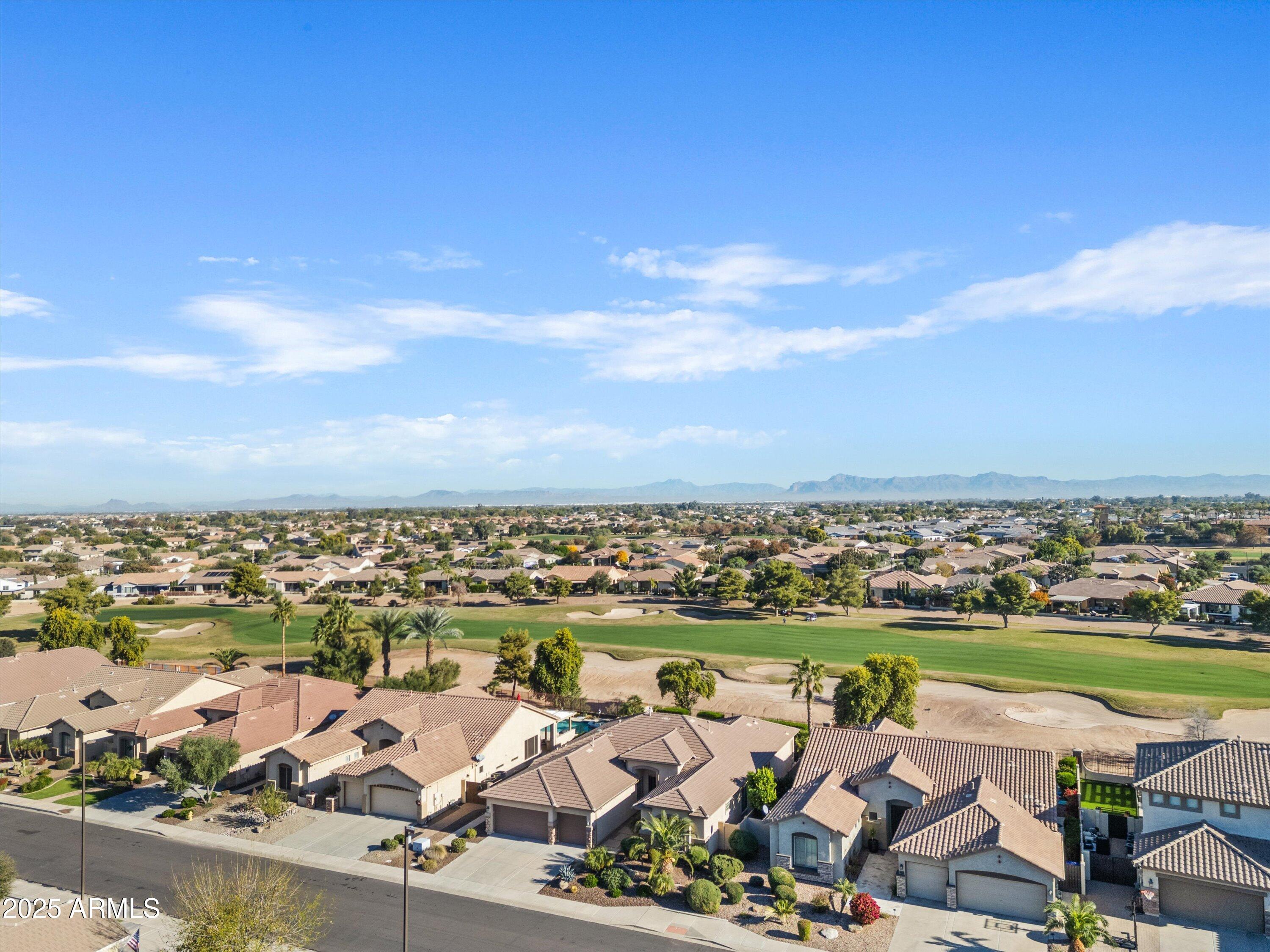 6805 Rachael Way Gilbert, AZ 85298 - Photo 48 of 50 an aerial view of a city with lots of residential buildings ocean and mountain view in back