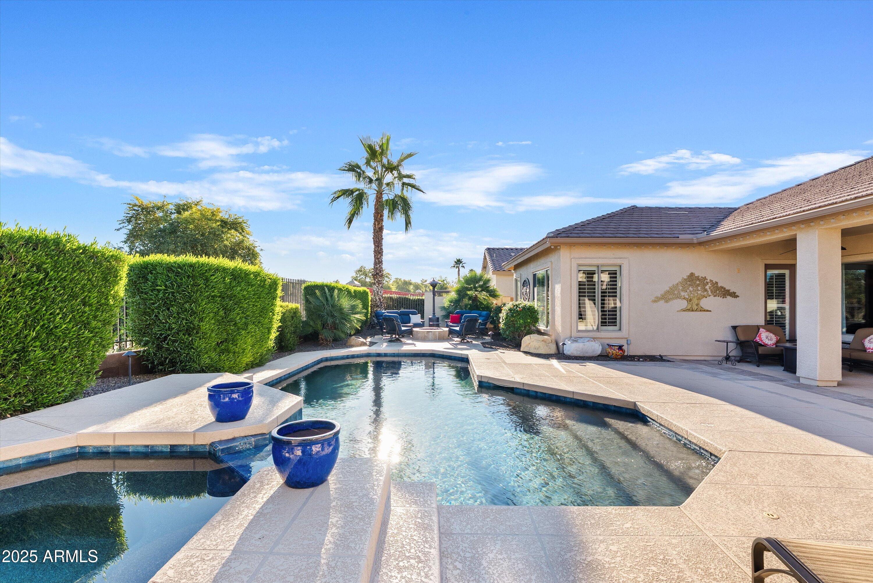 6805 Rachael Way Gilbert, AZ 85298 - Photo 4 of 50 a view of a swimming pool with a patio