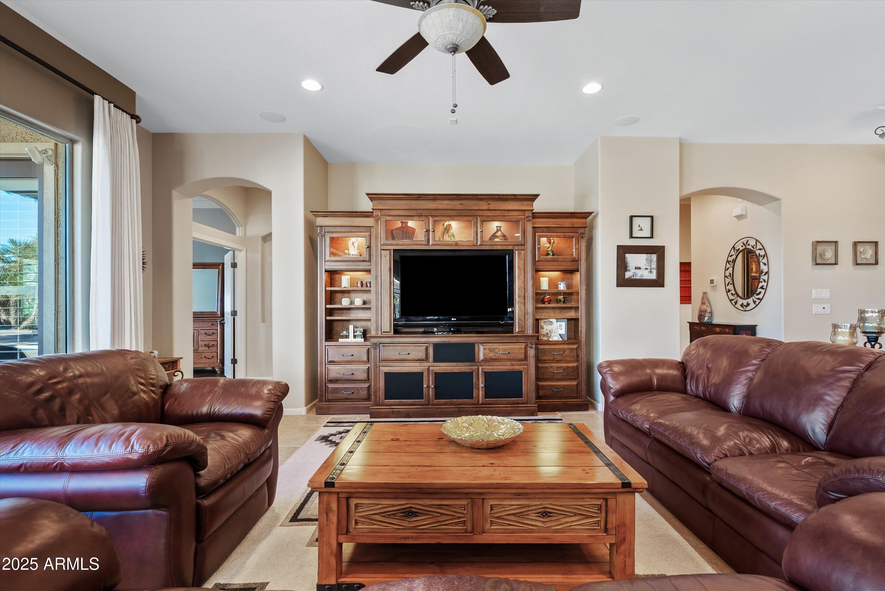 6805 Rachael Way Gilbert, AZ 85298 - Photo 8 of 50 a living room with furniture and a flat screen tv