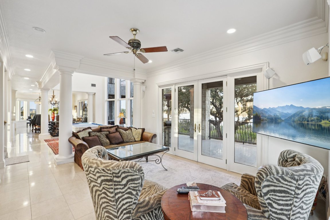 14701 Hornsby Hill Road Austin, TX 78734 - Photo 12 of 40 a living room with furniture and a flat screen tv