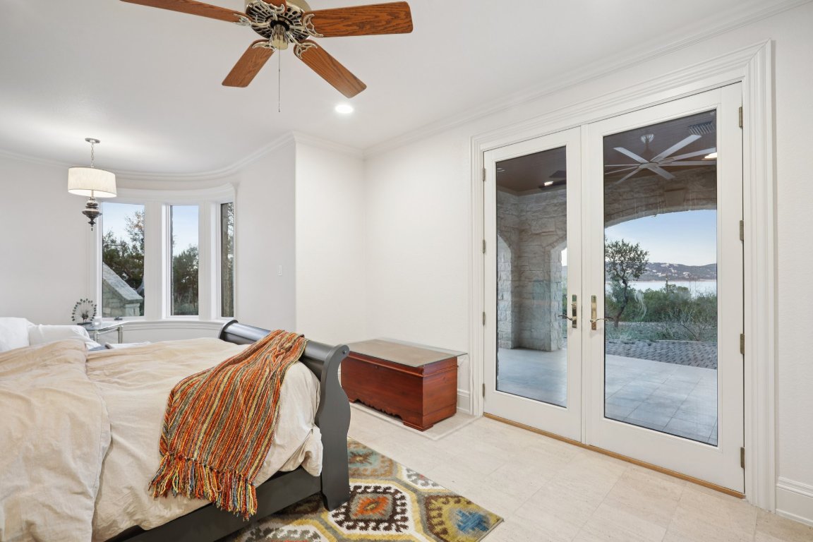 14701 Hornsby Hill Road Austin, TX 78734 - Photo 16 of 40 a bedroom with a bed and window