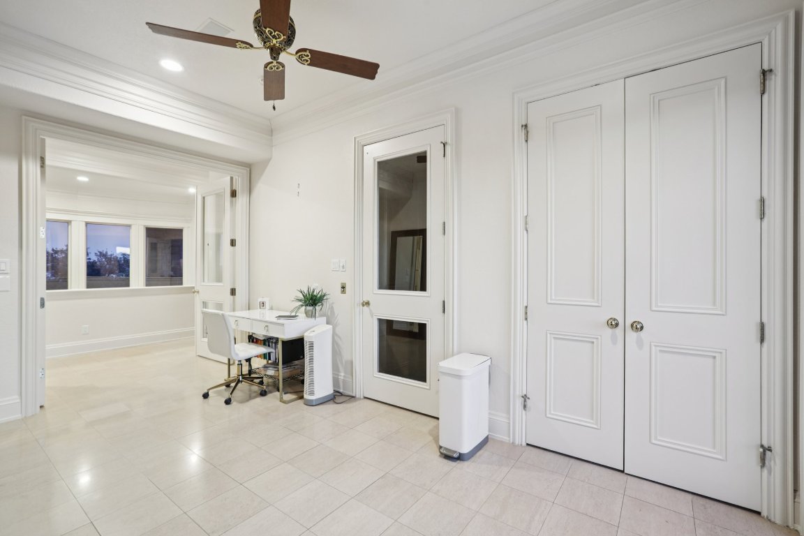 14701 Hornsby Hill Road Austin, TX 78734 - Photo 30 of 40 a view of a livingroom with furniture and a ceiling fan