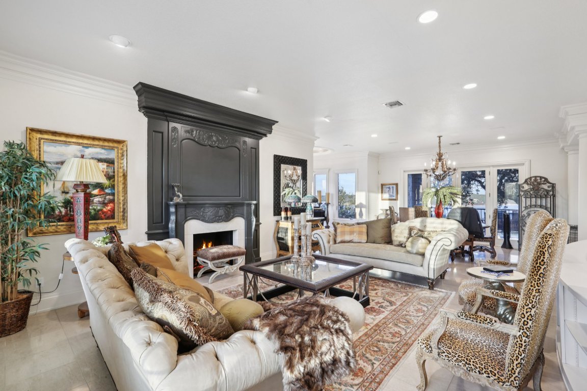 14701 Hornsby Hill Road Austin, TX 78734 - Photo 7 of 40 a living room with furniture fireplace and a fireplace
