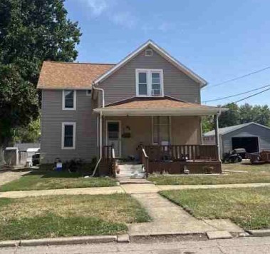 45 North 7th Avenue Canton, IL 61520 - Photo 2 of 4 a front view of a house with garden