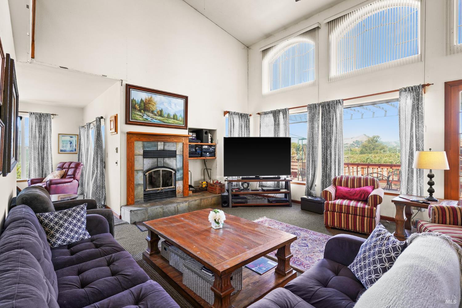 5267 Old Sonoma Road Napa, CA 94559 - Photo 12 of 24 a living room with furniture and a flat screen tv