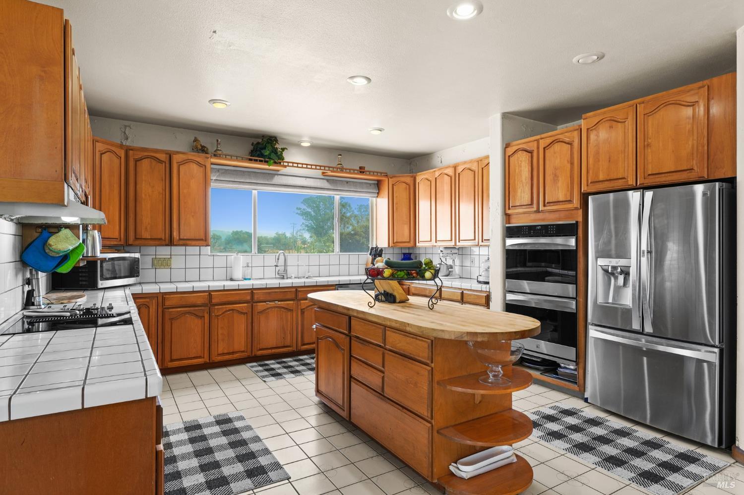 5267 Old Sonoma Road Napa, CA 94559 - Photo 13 of 24 a kitchen with a sink stove and refrigerator