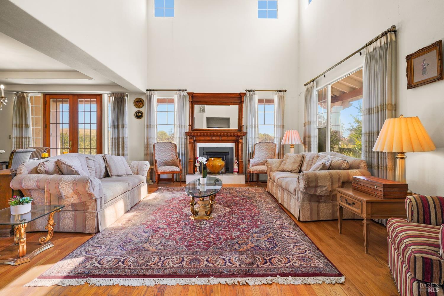 5267 Old Sonoma Road Napa, CA 94559 - Photo 8 of 24 a living room with furniture a rug and a fireplace