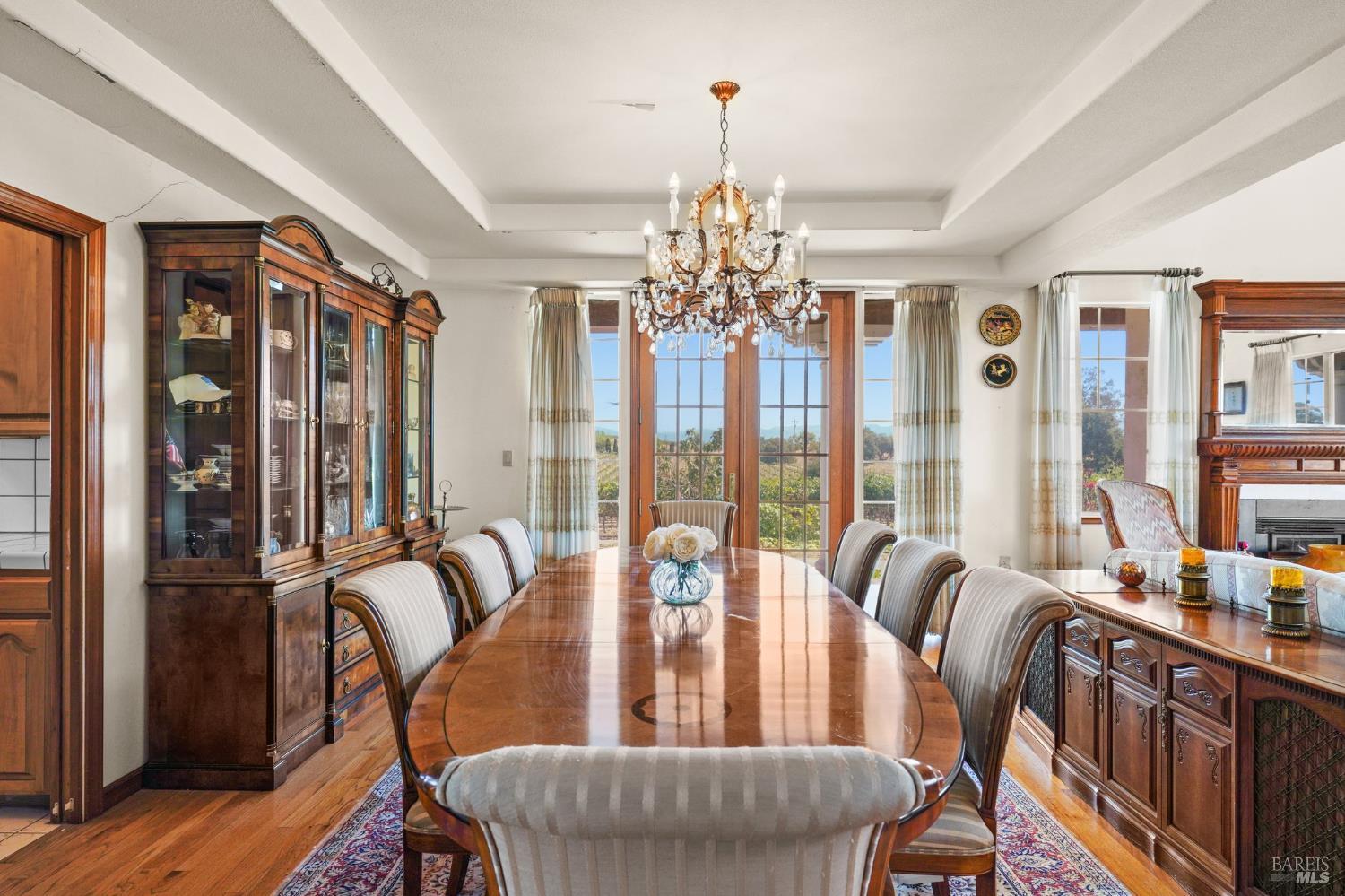 5267 Old Sonoma Road Napa, CA 94559 - Photo 10 of 24 a living room with furniture and a chandelier
