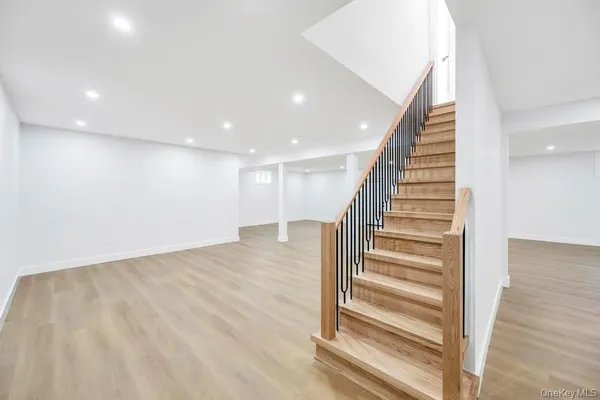 a view of entryway with wooden floor