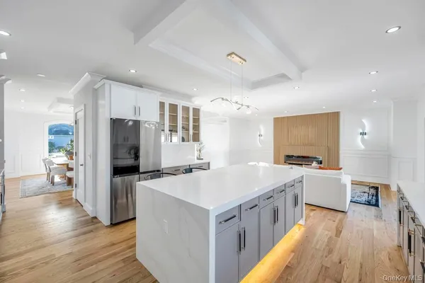 a kitchen with a stove a refrigerator and a sink