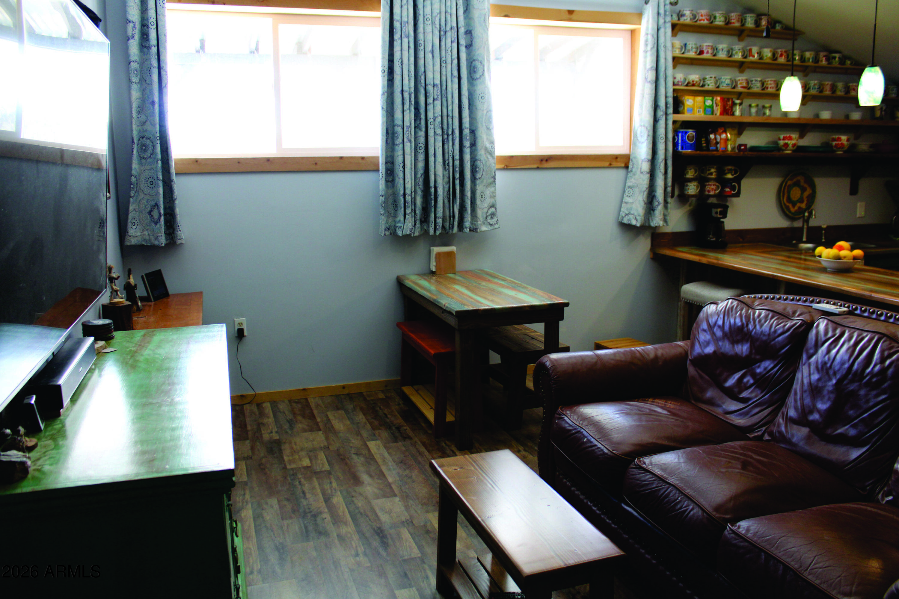 3236 North Cascabel Road Benson, AZ 85602 - Photo 11 of 63 a living room with furniture and a window