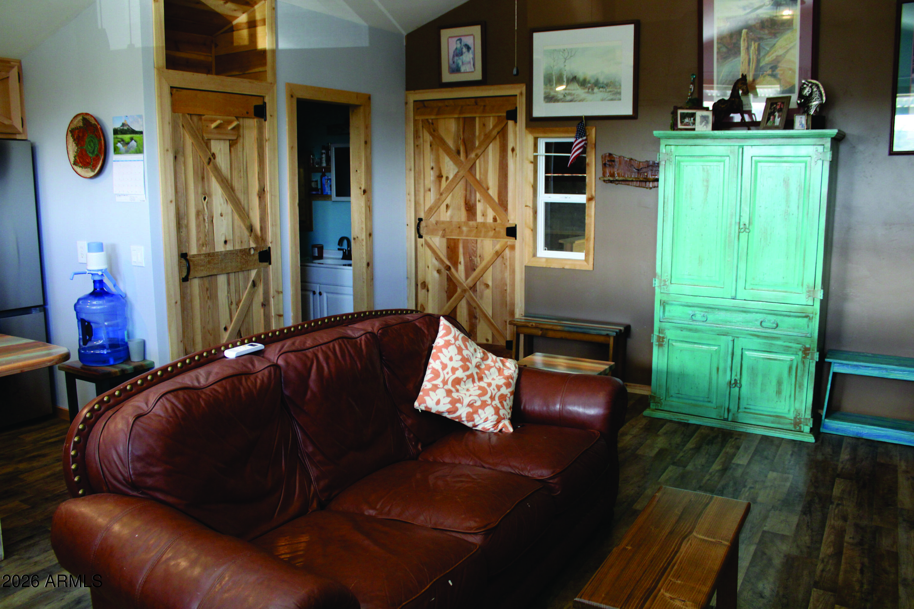3236 North Cascabel Road Benson, AZ 85602 - Photo 18 of 63 a living room with furniture and a window