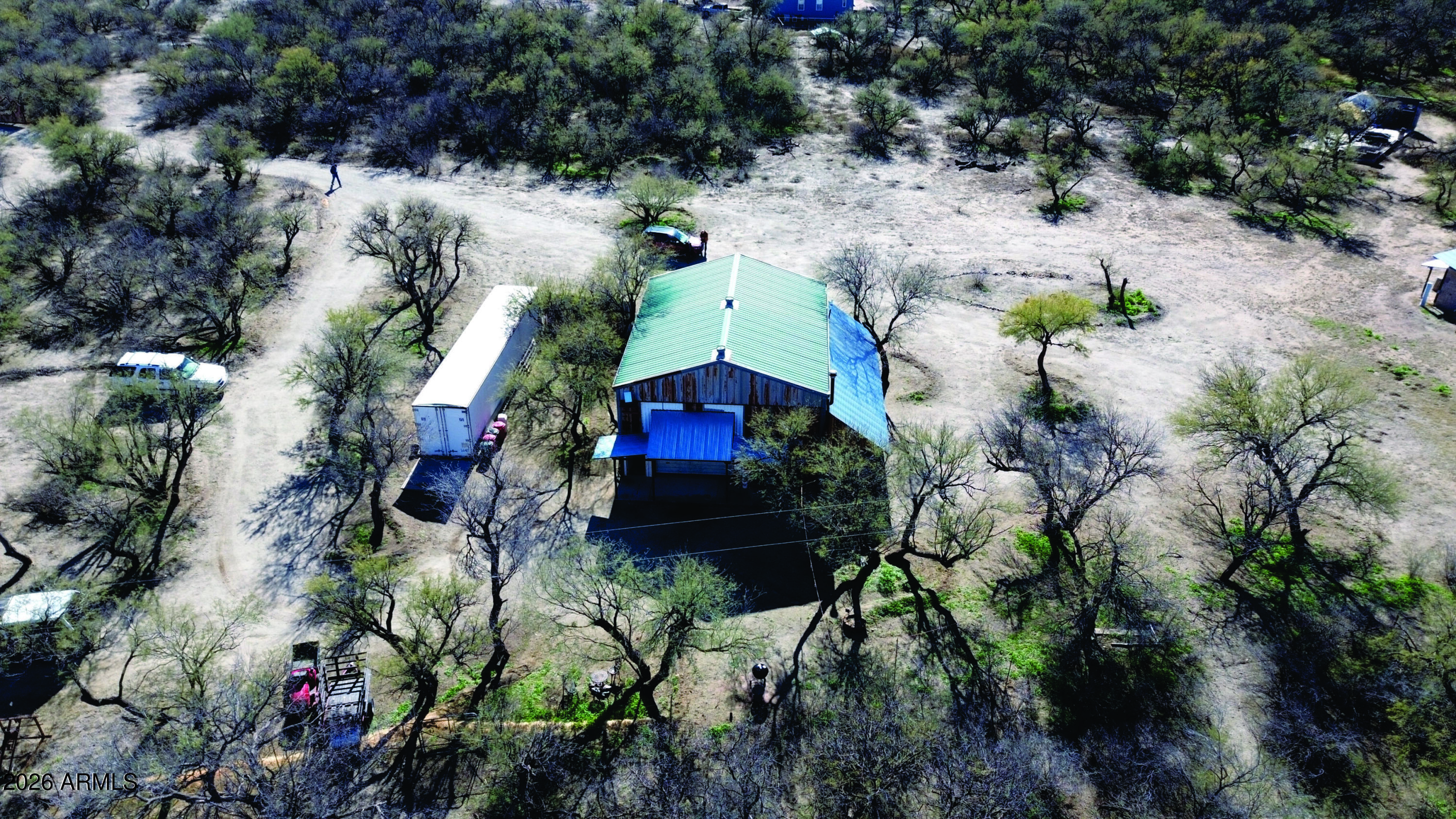 3236 North Cascabel Road Benson, AZ 85602 - Photo 24 of 63 a aerial view of a house with a yard