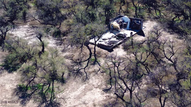 a view of a dry yard with sunset view