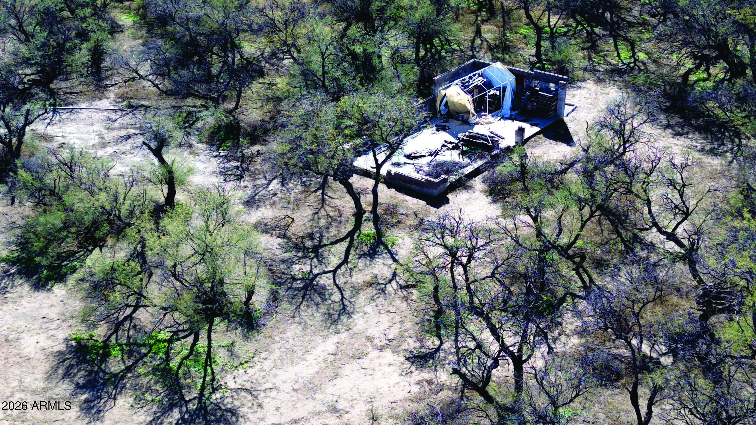 3236 North Cascabel Road Benson, AZ 85602 - Photo 27 of 63 a backyard of a house with lots of green space