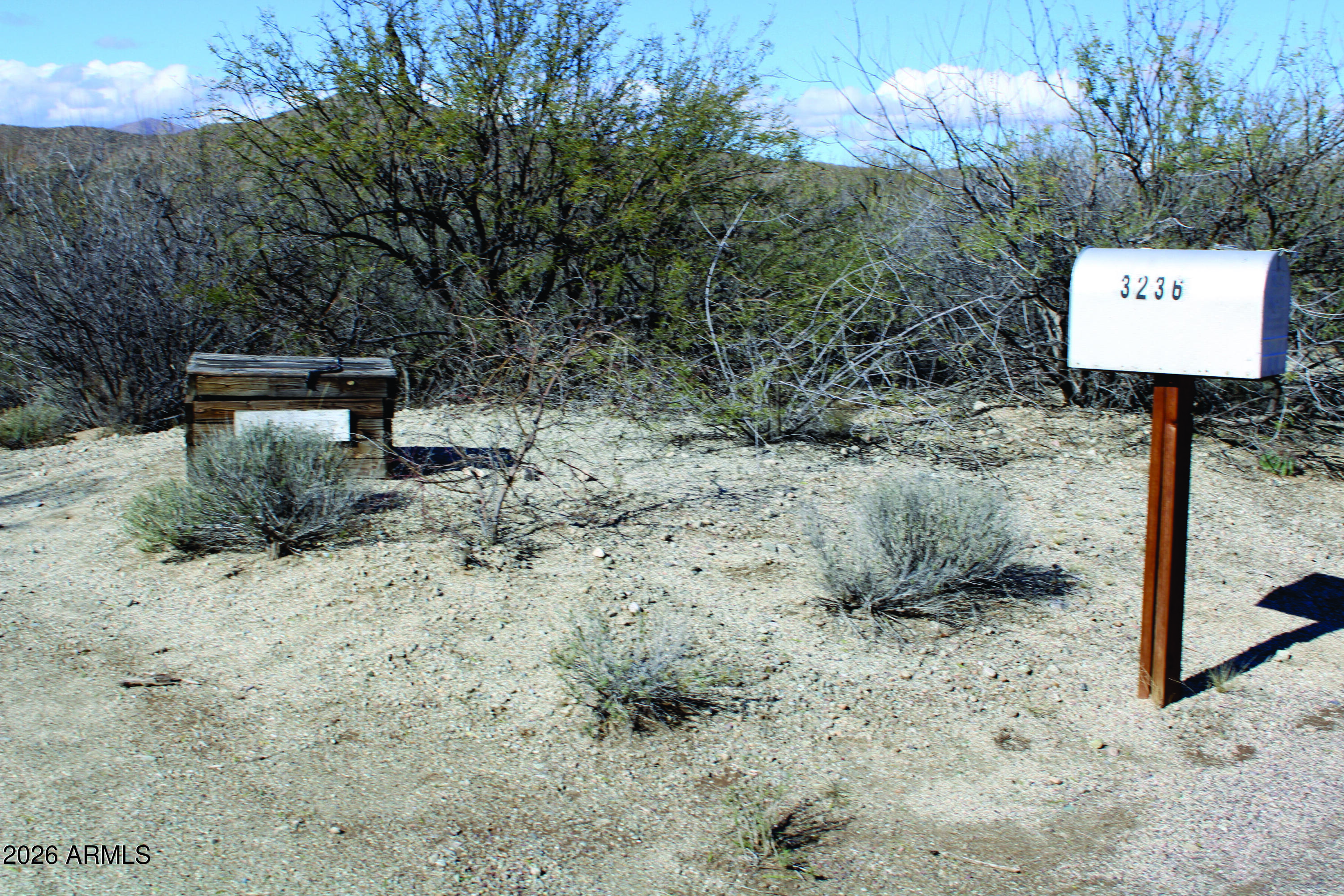 3236 North Cascabel Road Benson, AZ 85602 - Photo 3 of 63 a sign board with parking space