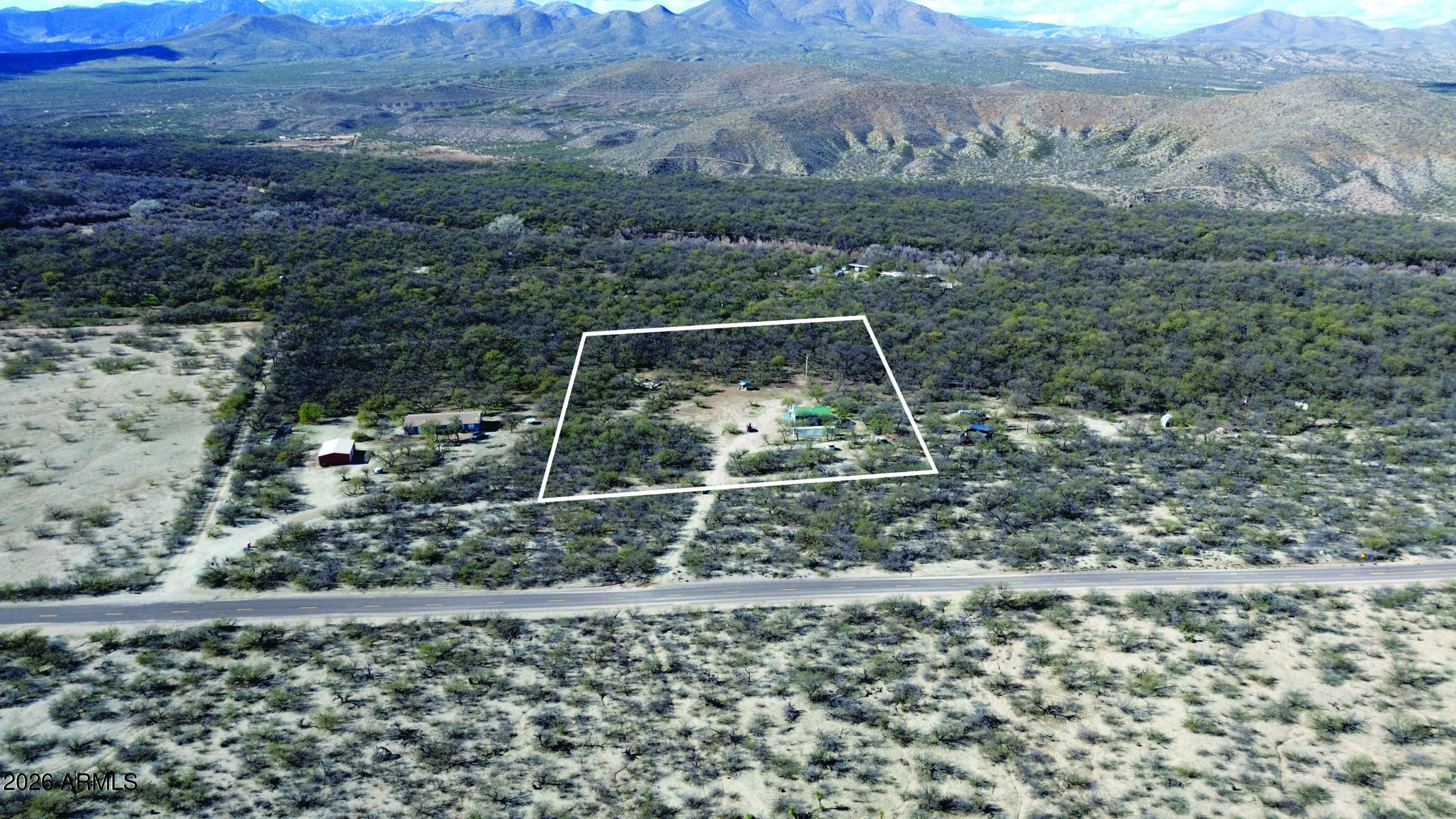 3236 North Cascabel Road Benson, AZ 85602 - Photo 35 of 63 a view of a backyard
