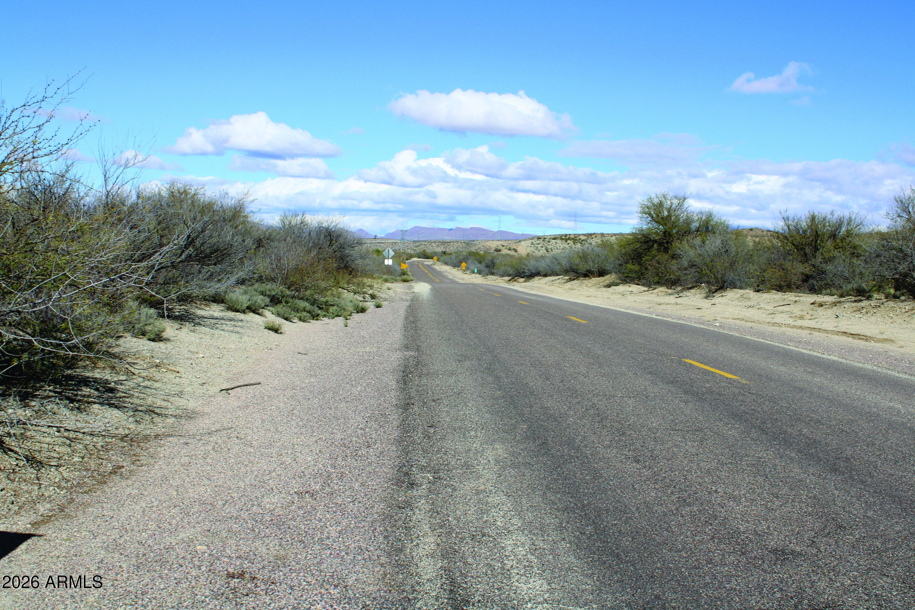3236 North Cascabel Road Benson, AZ 85602 - Photo 38 of 63 a view of a dry yard with sunset view