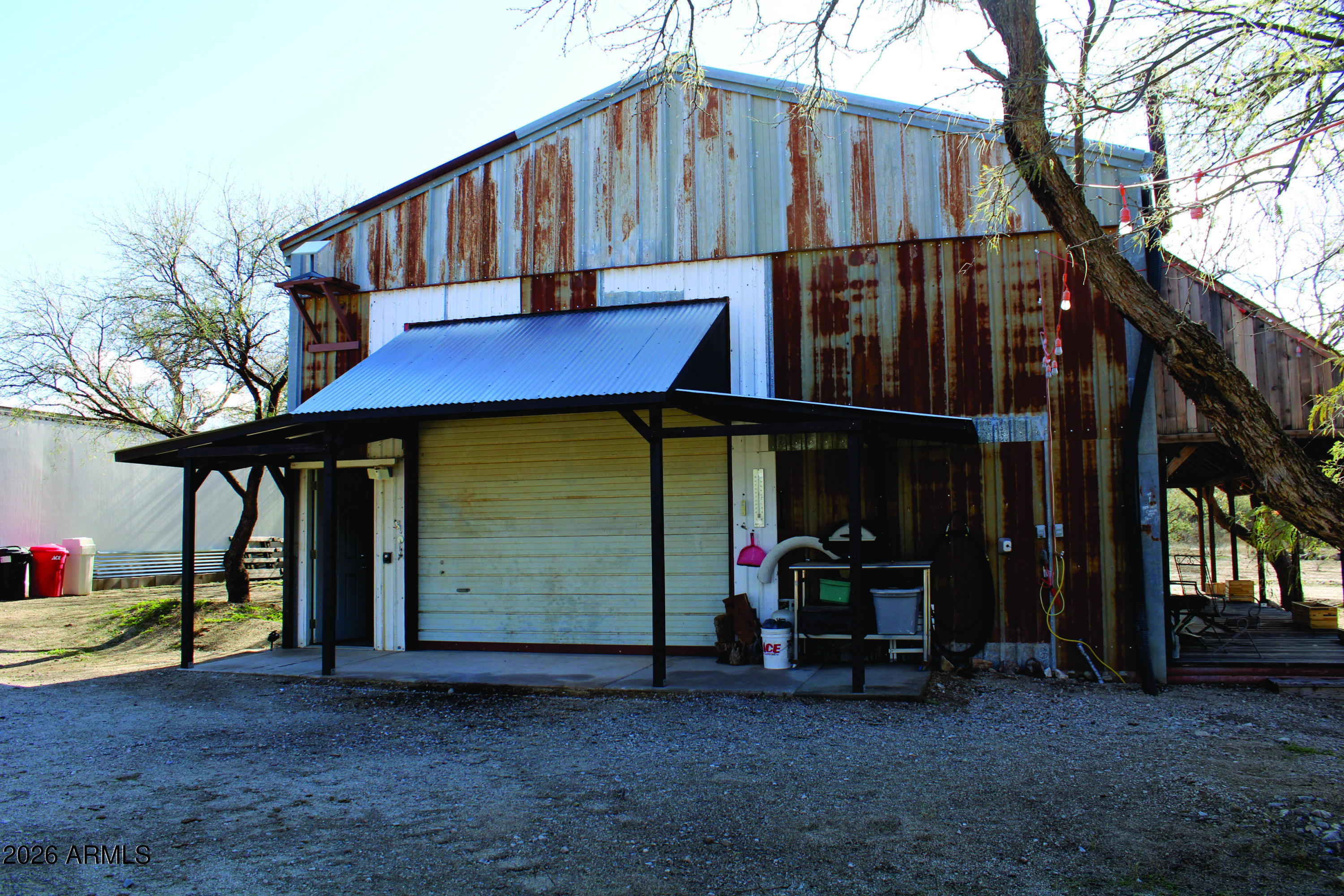 3236 North Cascabel Road Benson, AZ 85602 - Photo 47 of 63 a view of a car park in front of house