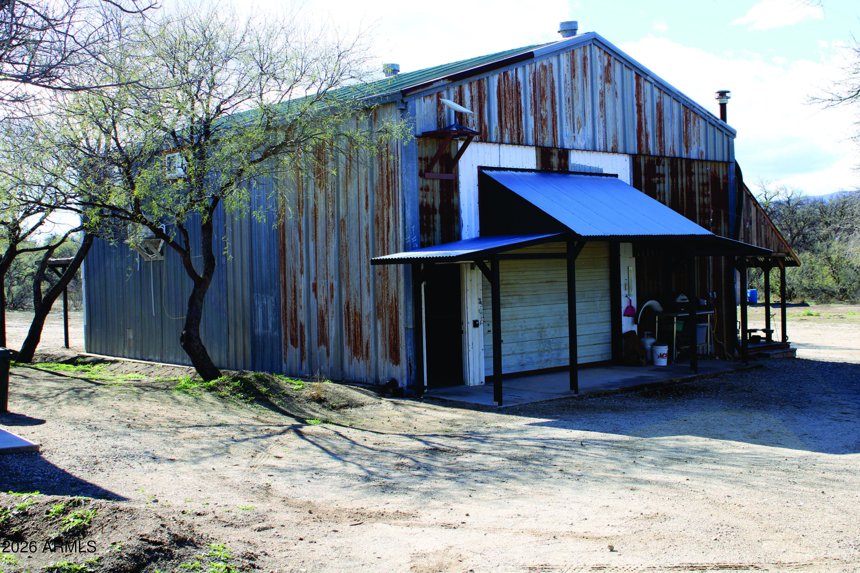 3236 North Cascabel Road Benson, AZ 85602 - Photo 48 of 63 a view of a house with wooden fence