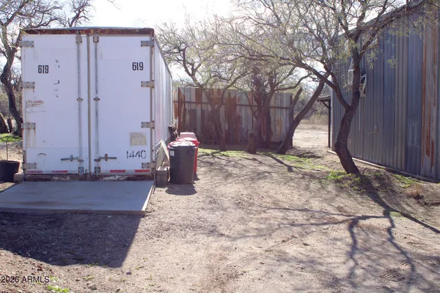 a view of a chairs and tables in the patio