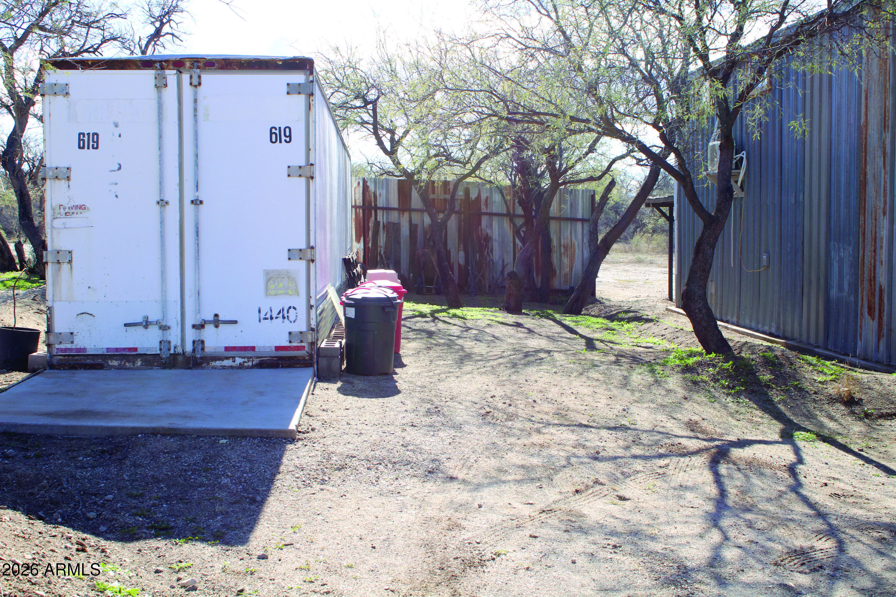 3236 North Cascabel Road Benson, AZ 85602 - Photo 49 of 63 a view of a backyard with large tree
