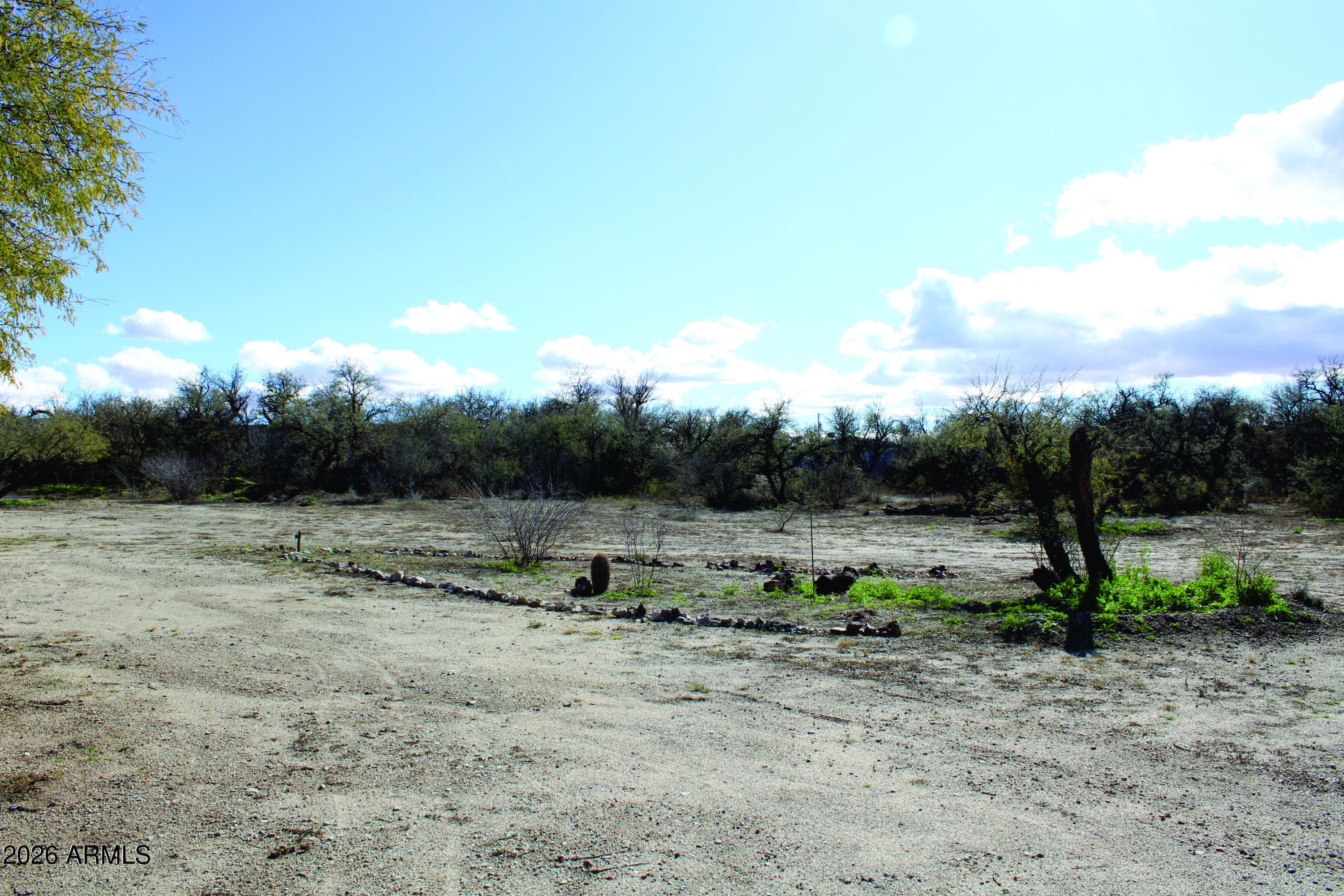 3236 North Cascabel Road Benson, AZ 85602 - Photo 54 of 63 a view of outdoor space with green field and trees