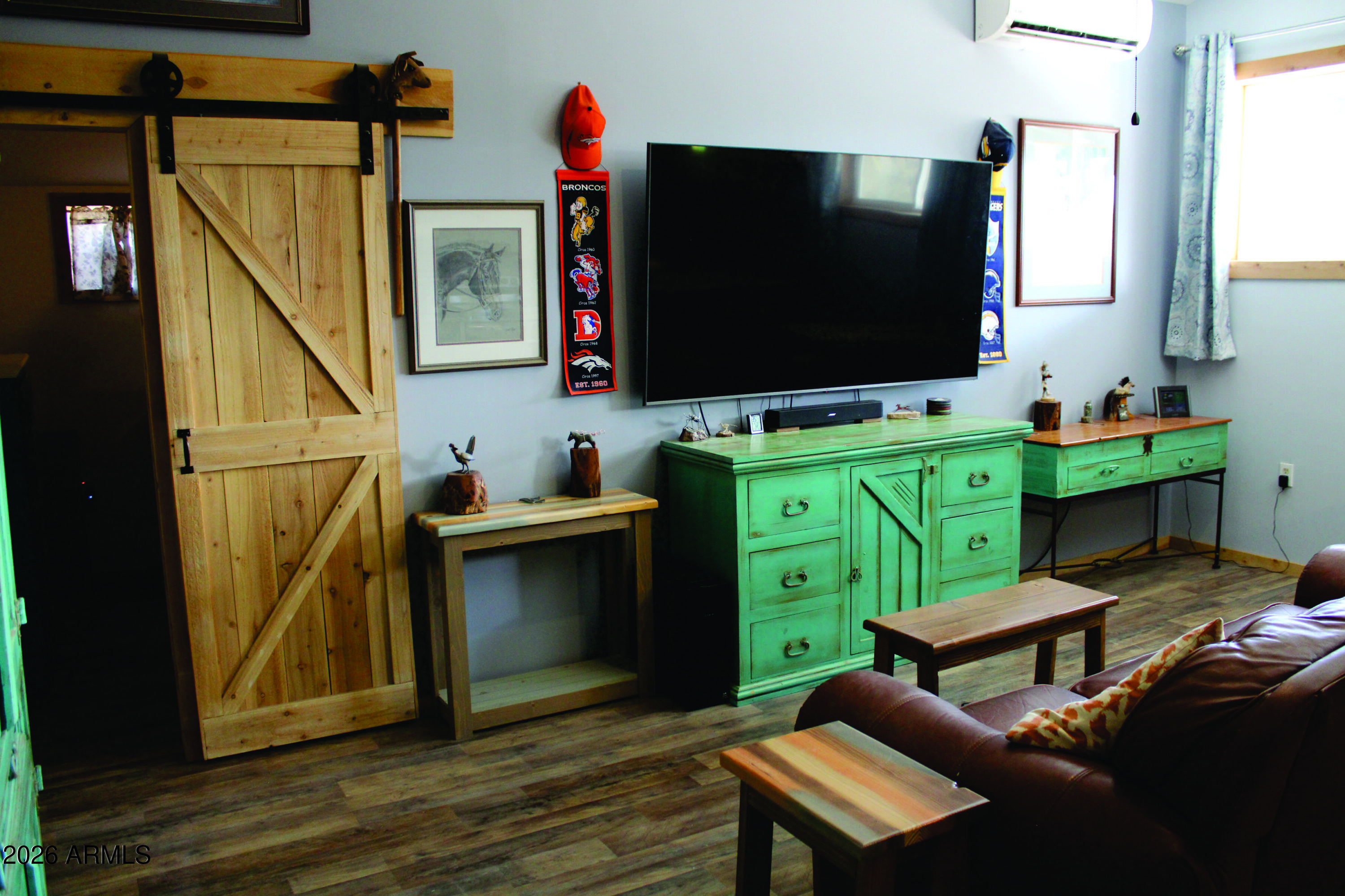 3236 North Cascabel Road Benson, AZ 85602 - Photo 10 of 63 a living room with furniture and a flat screen tv