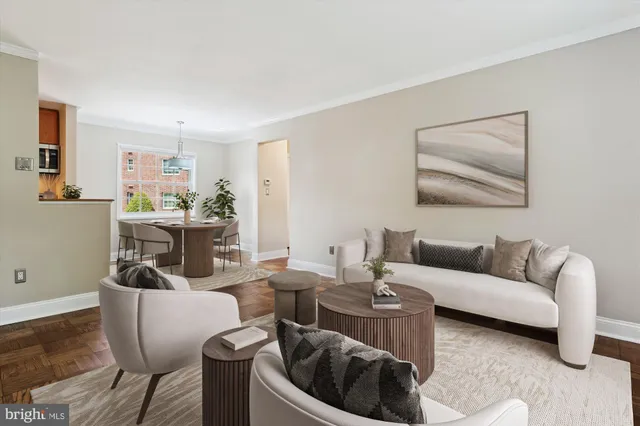 a living room with furniture and a painting