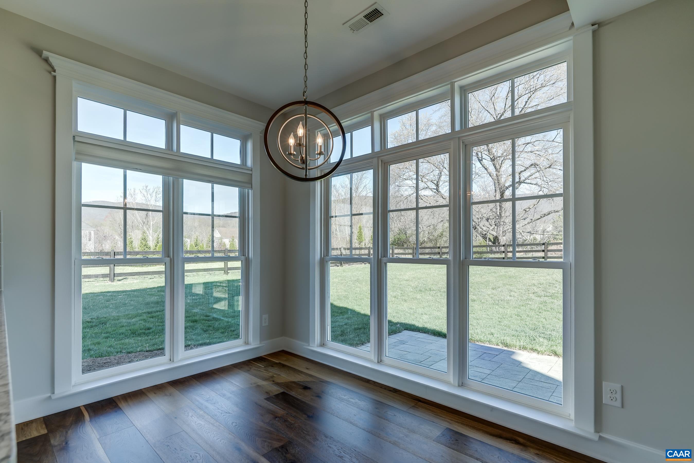 7659 Birchwood Hill Road Crozet, VA 22932 - Photo 19 of 64 a view of an empty room with wooden floor and a window