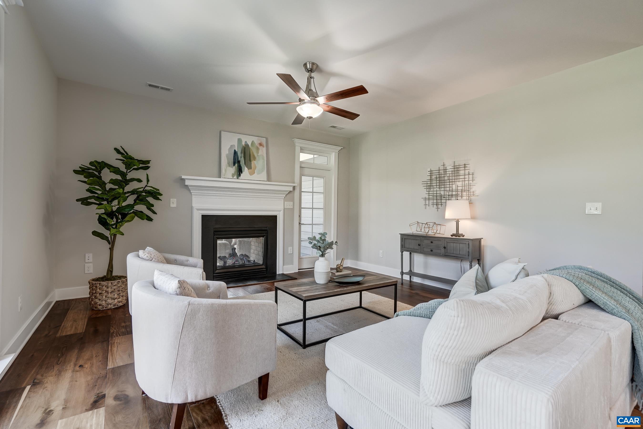 7659 Birchwood Hill Road Crozet, VA 22932 - Photo 21 of 64 a living room with furniture a fireplace and a potted plant
