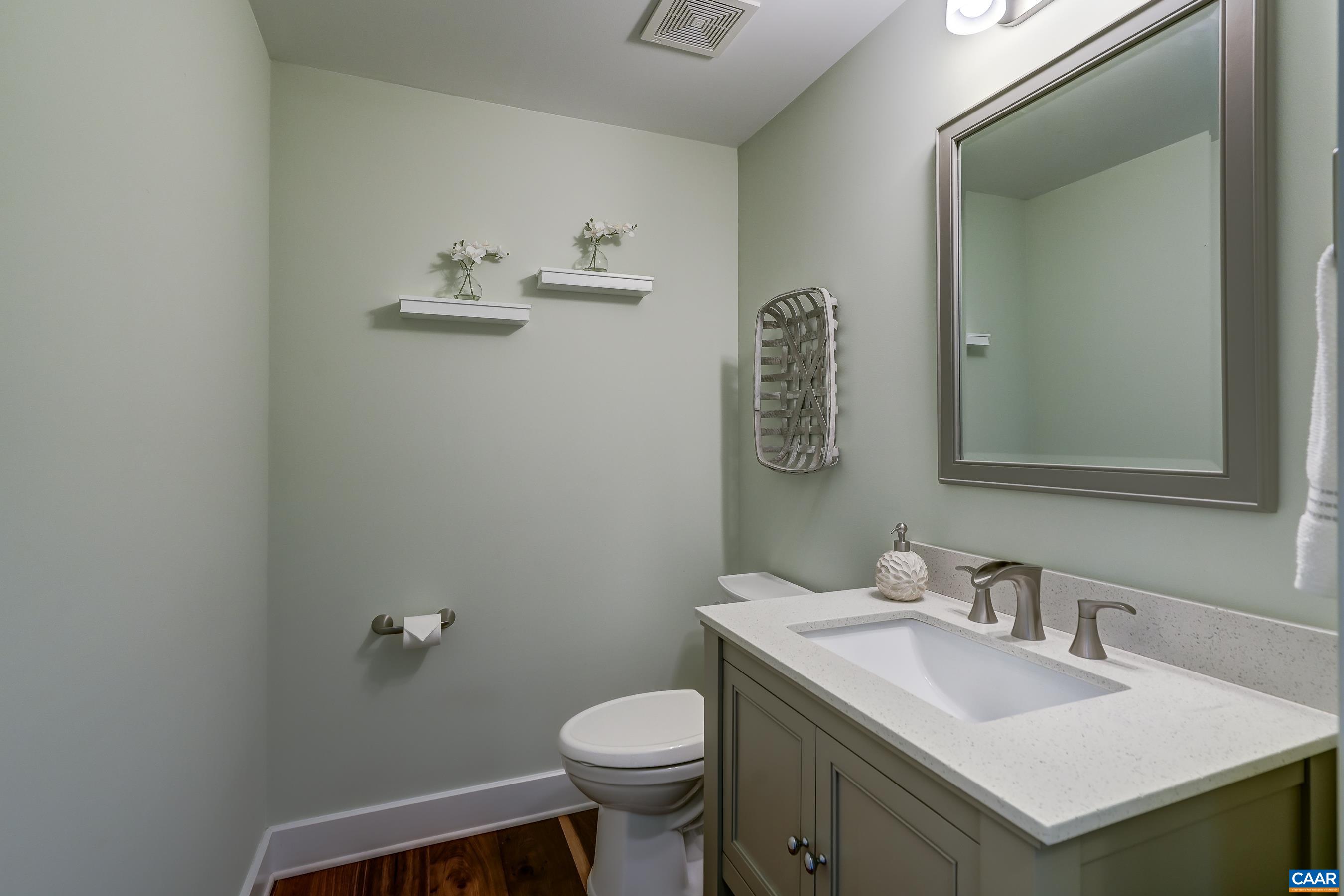 7659 Birchwood Hill Road Crozet, VA 22932 - Photo 26 of 64 a bathroom with a sink toilet and mirror