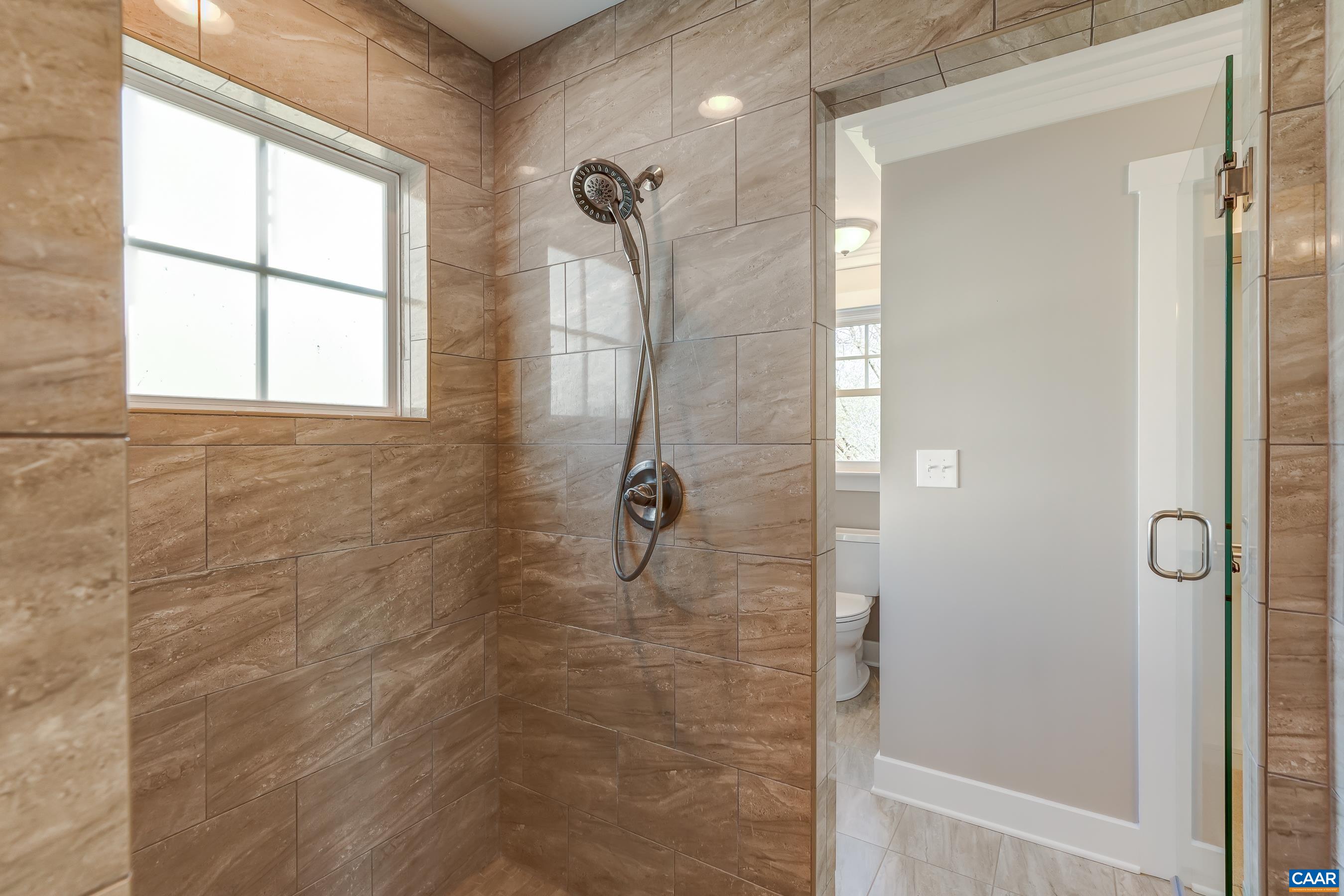 7659 Birchwood Hill Road Crozet, VA 22932 - Photo 32 of 64 Pass through tiled shower with frameless glass doors.