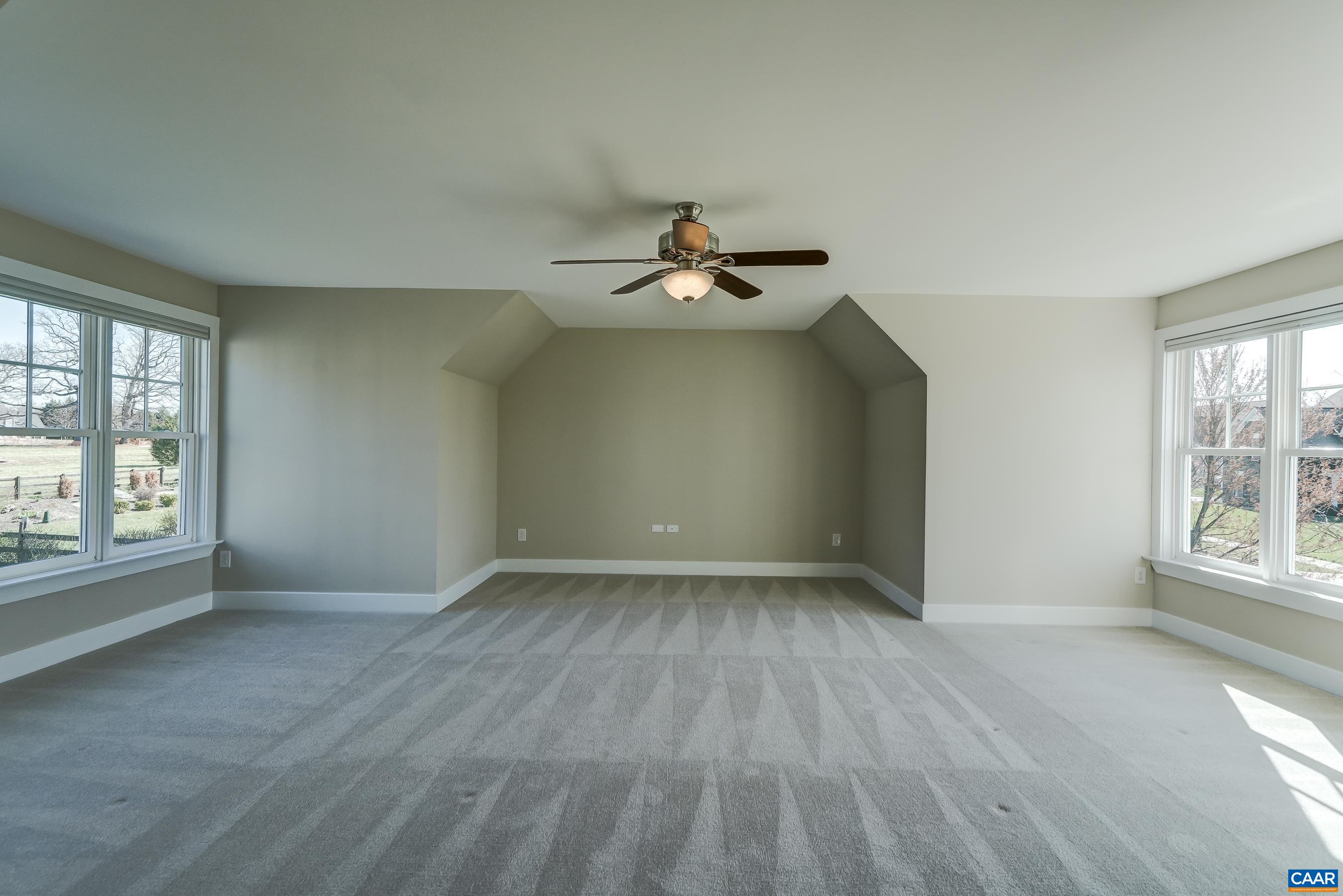 7659 Birchwood Hill Road Crozet, VA 22932 - Photo 39 of 64 an empty room with wooden floor and windows