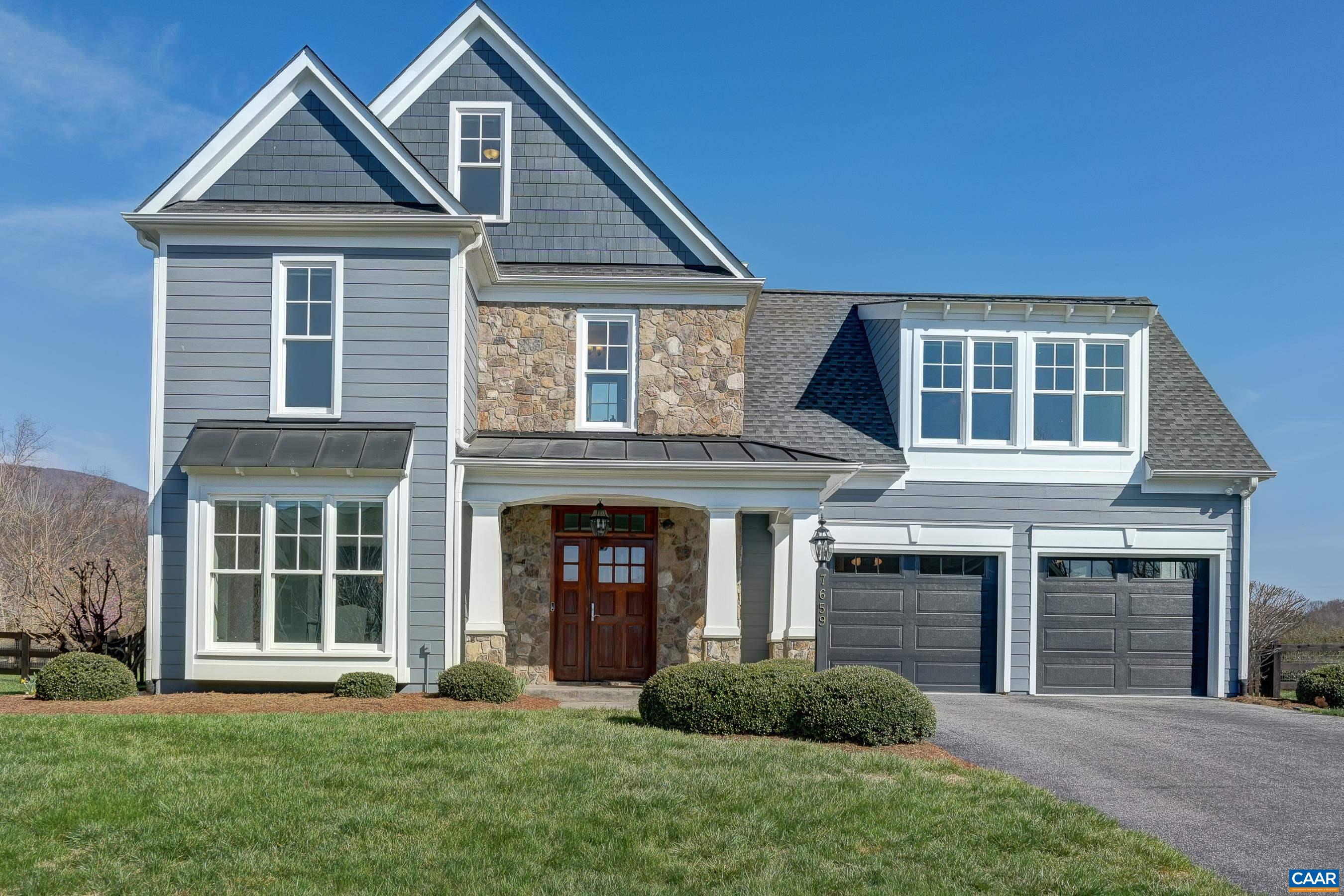 7659 Birchwood Hill Road Crozet, VA 22932 - Photo 52 of 64 a front view of a house with a yard