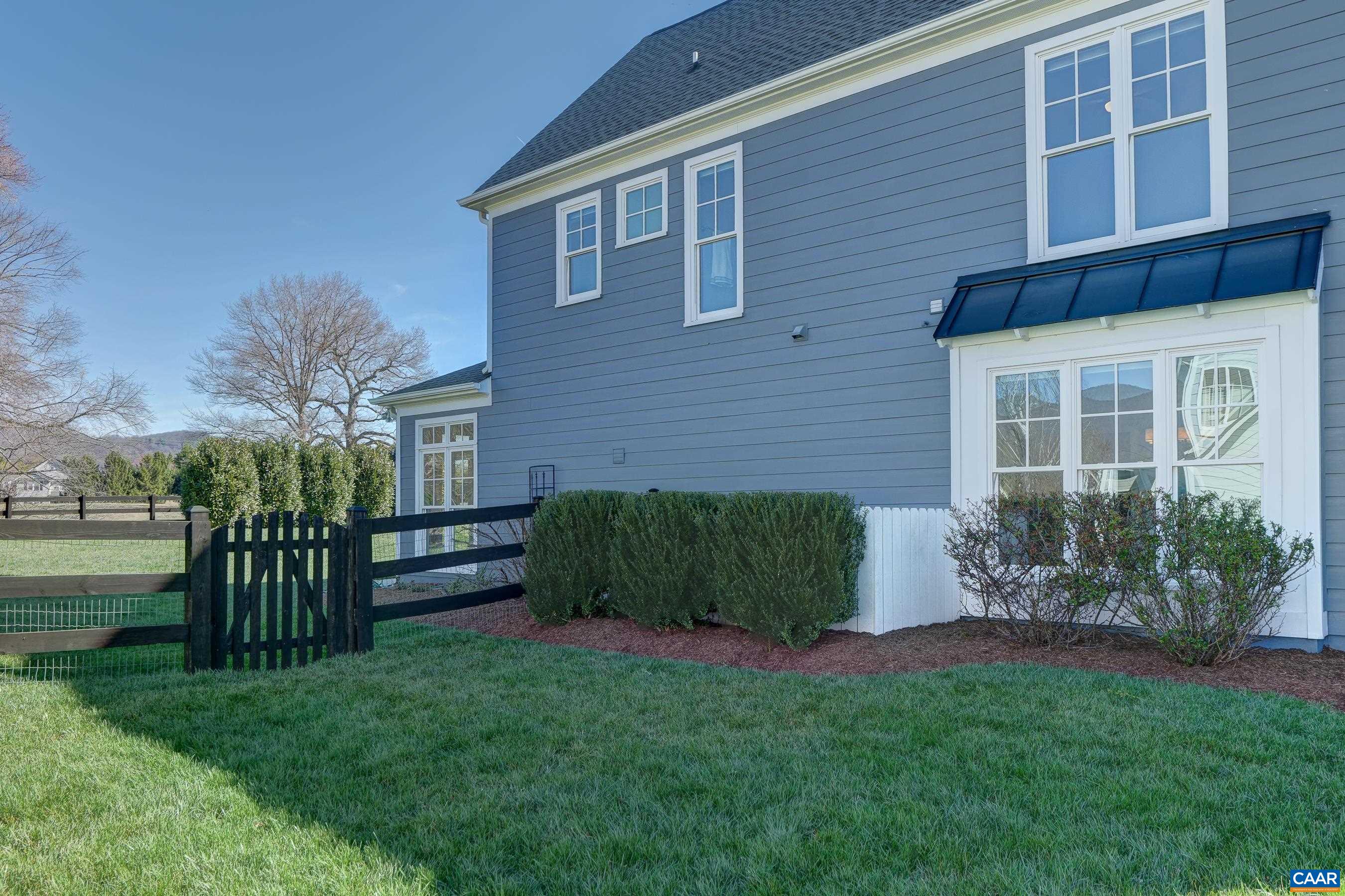 7659 Birchwood Hill Road Crozet, VA 22932 - Photo 54 of 64 a view of a house with a yard and plants