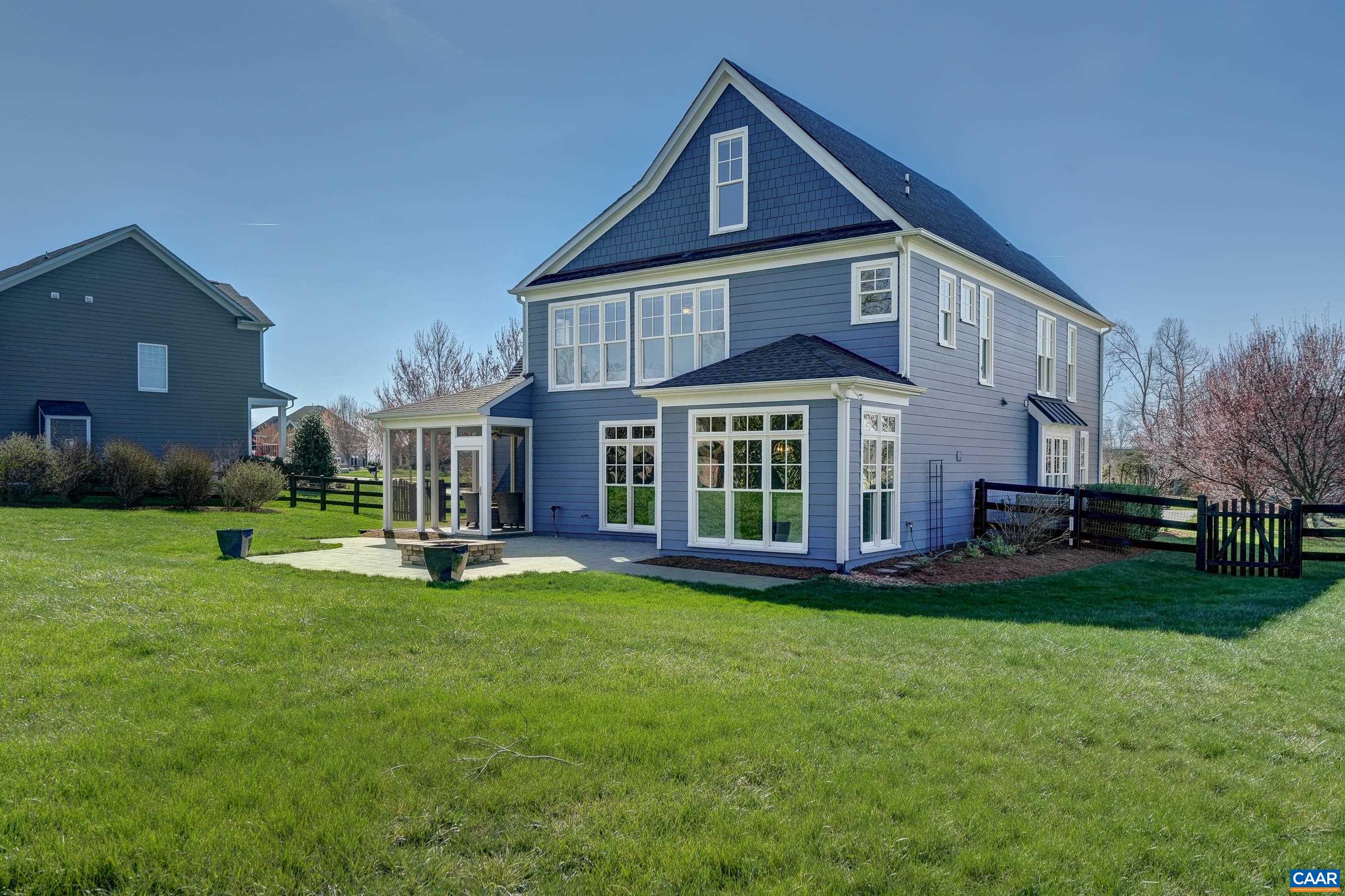7659 Birchwood Hill Road Crozet, VA 22932 - Photo 56 of 64 a front view of a house with a yard table and chairs