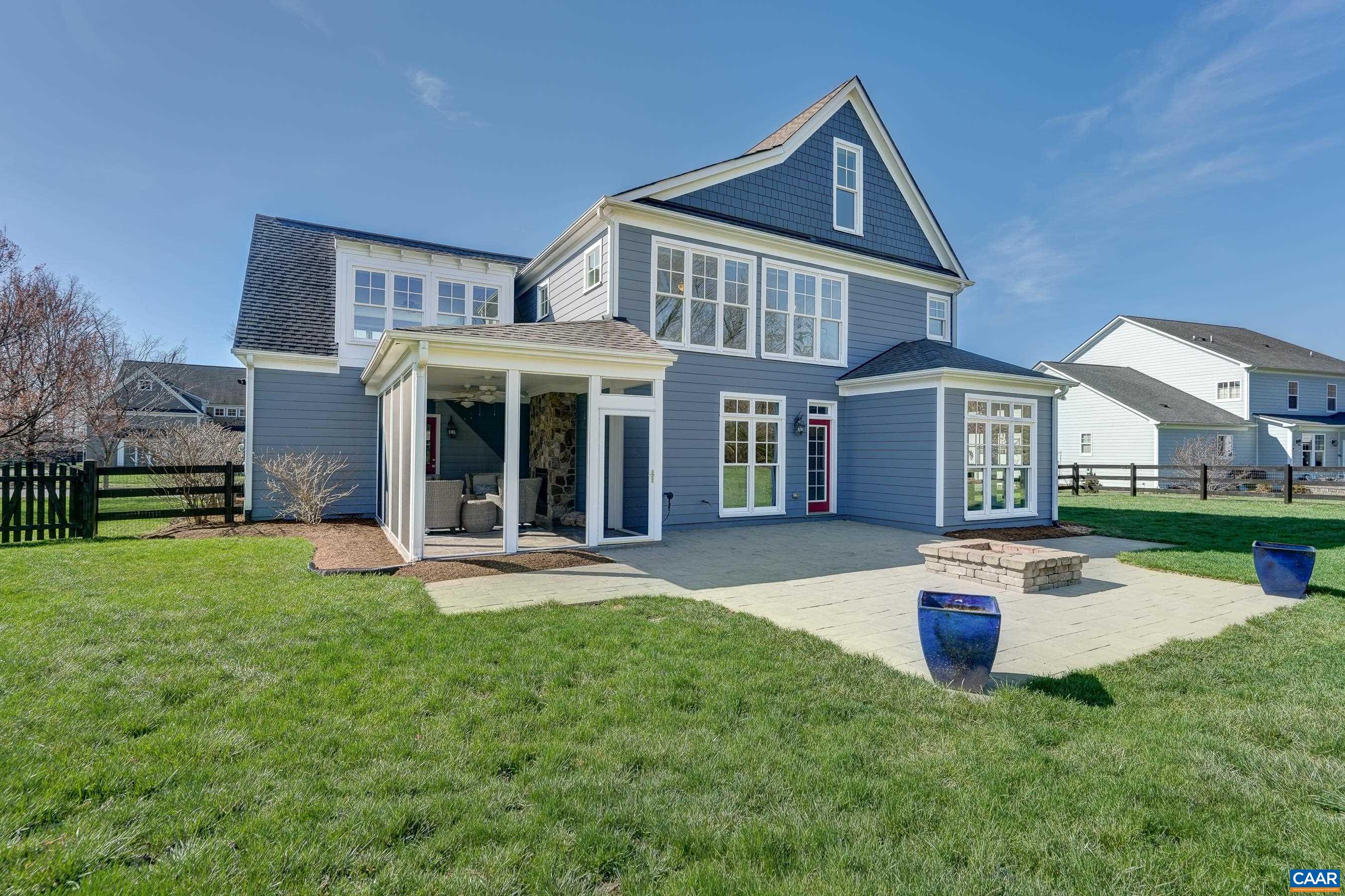 7659 Birchwood Hill Road Crozet, VA 22932 - Photo 58 of 64 a front view of a house with a yard table and chairs