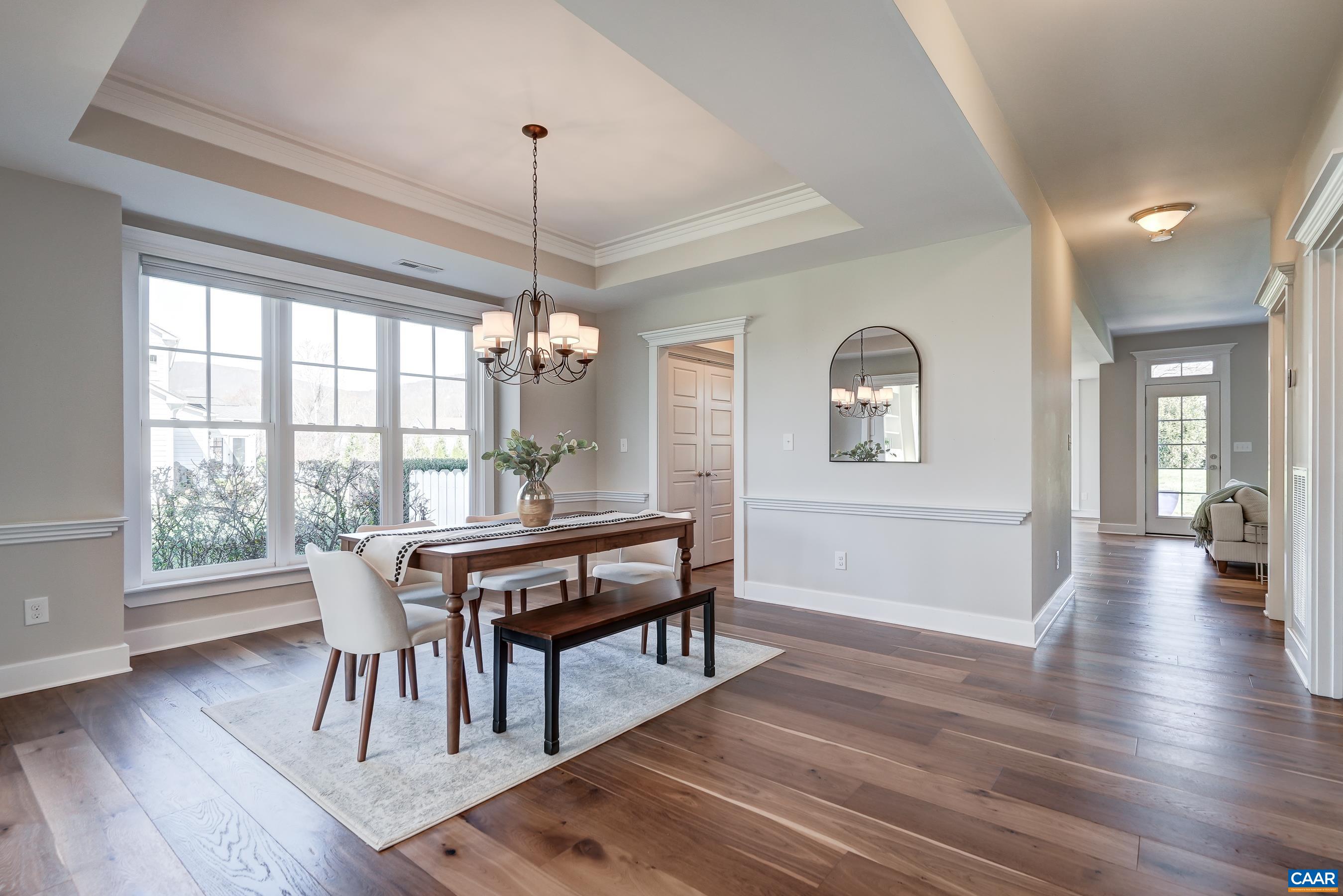 7659 Birchwood Hill Road Crozet, VA 22932 - Photo 7 of 64 a view of a dining room with furniture window and wooden floor