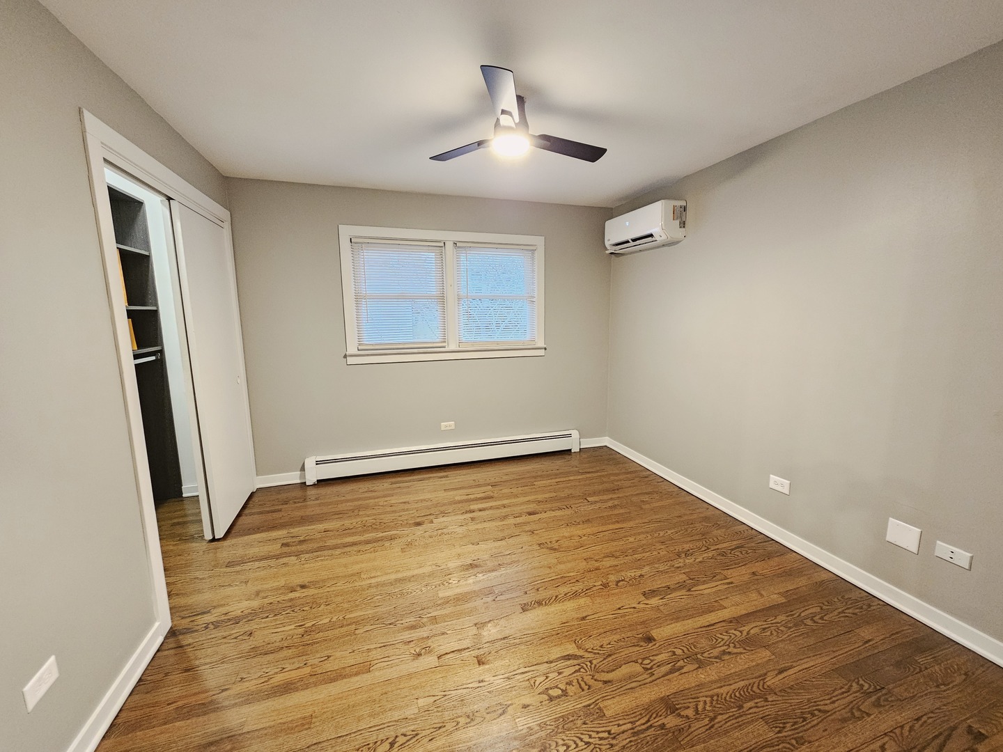 311 Maple Avenue, Unit 2 Downers Grove, IL 60515 - Photo 19 of 33 a view of an empty room with wooden floor and a window